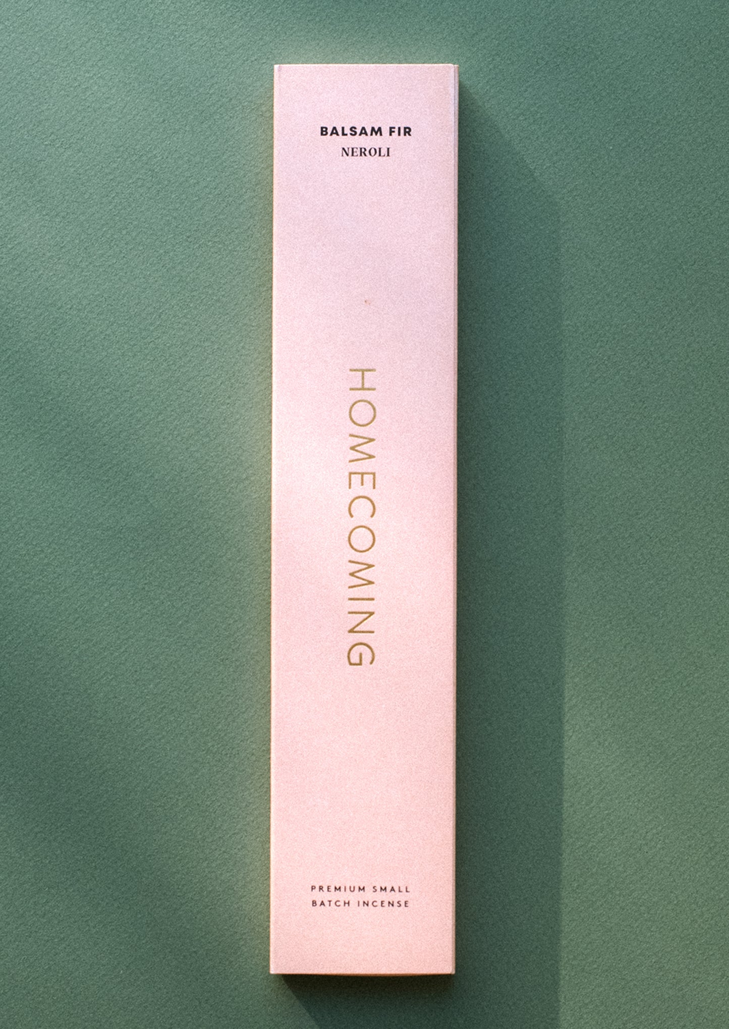 A box of incense in coral color, balsam neroli scent.