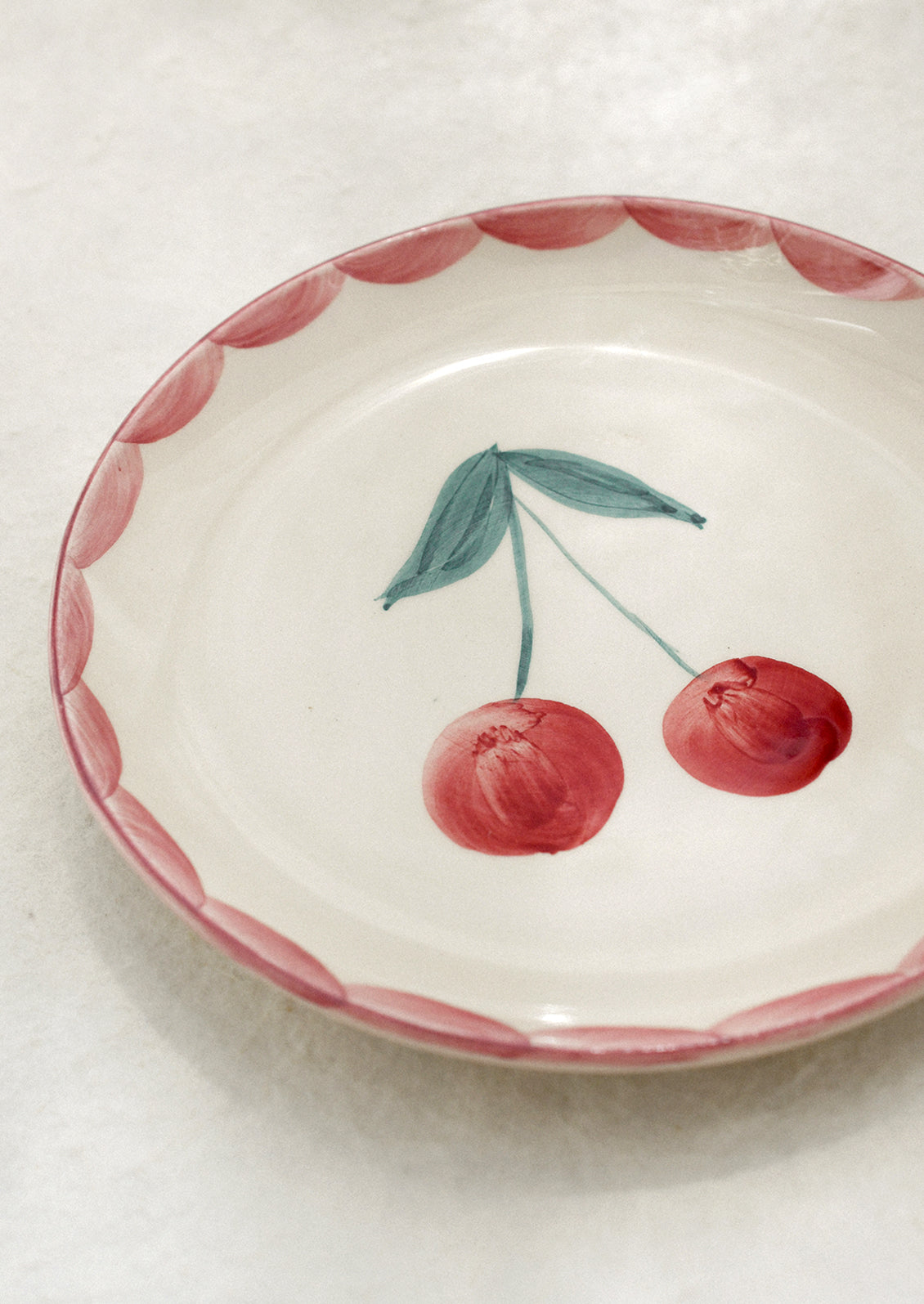 Small ceramic dish with cherry design.