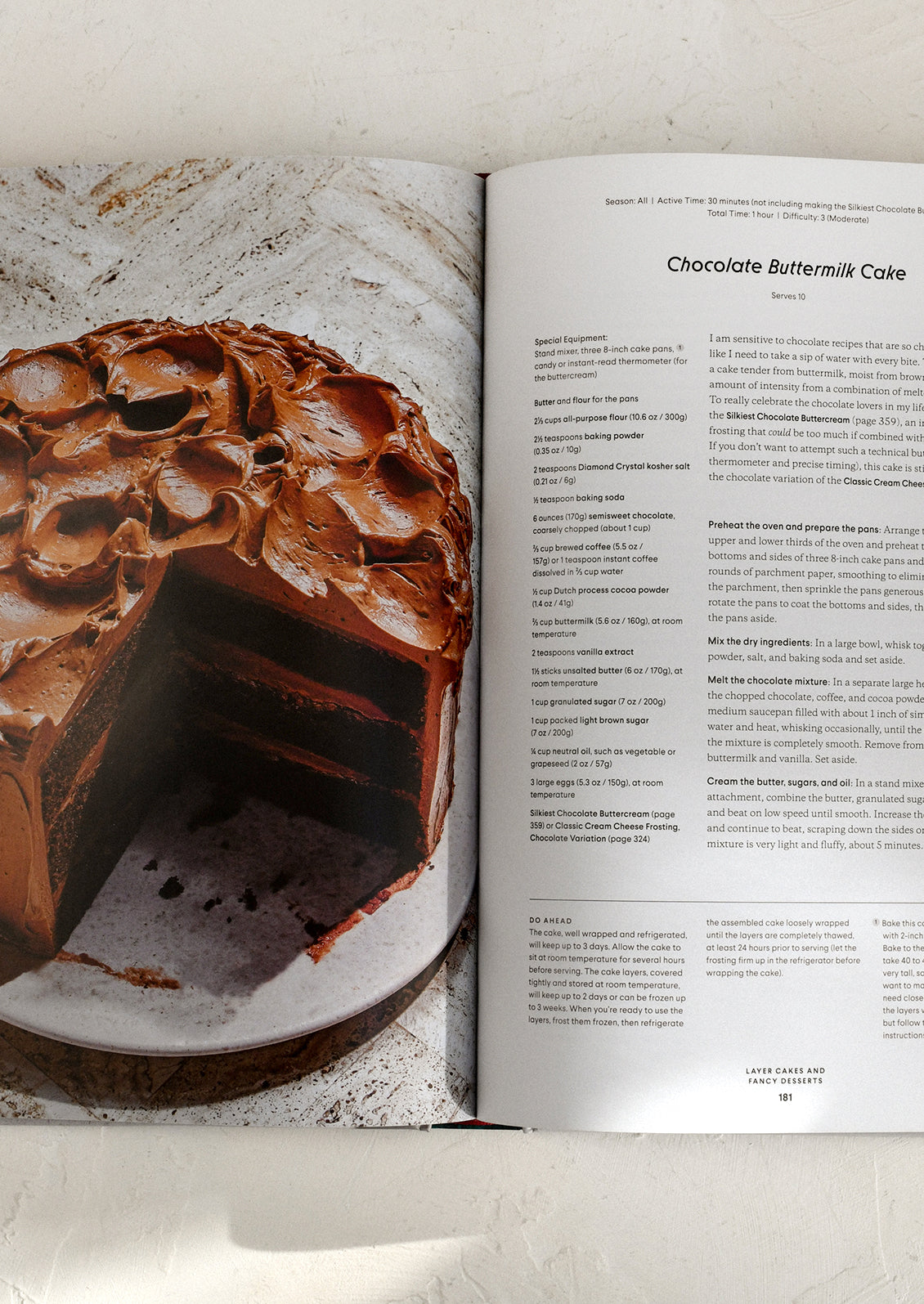 Open cookbook showing a chocolate buttermilk cake and recipe text.