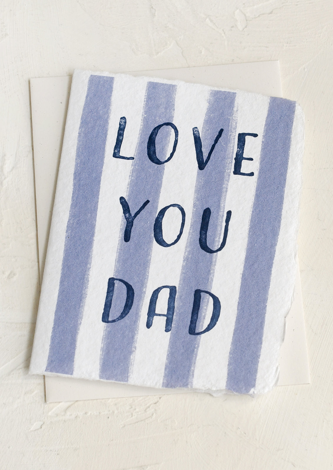 Striped card with 'Love You Dad' text on a light background