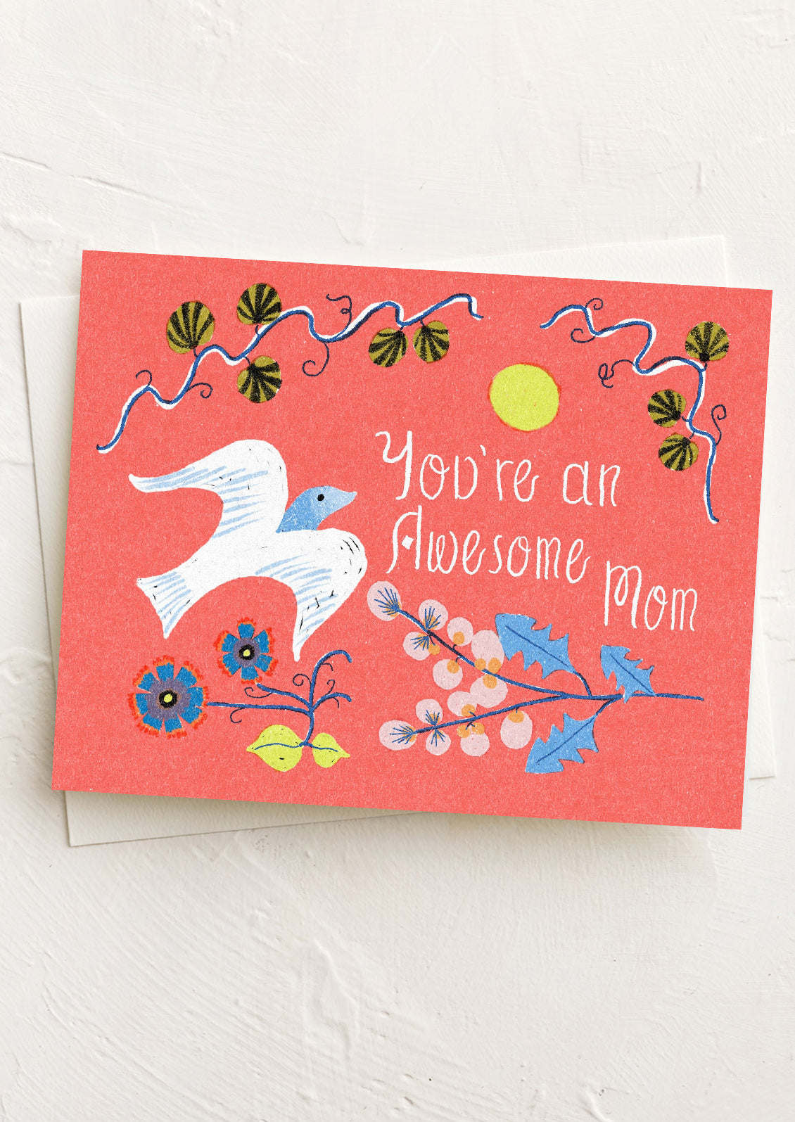 Greeting card with a dove and floral design on a red background, featuring the text 'You're an Awesome Mom'.