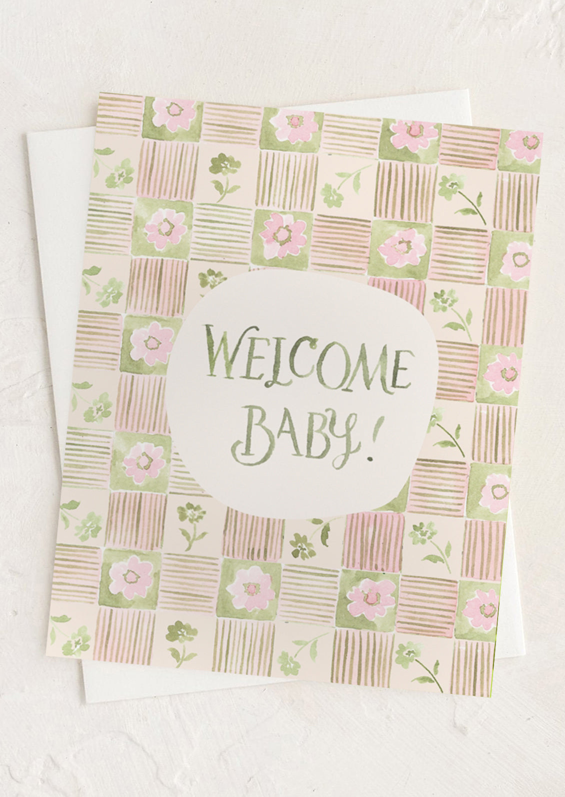 Greeting card with 'Welcome Baby!' text and floral pattern on a white background