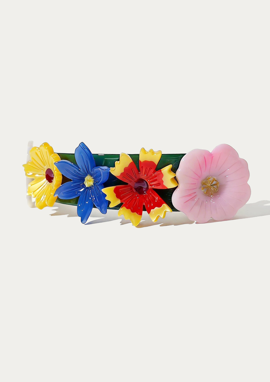 Colorful flower-shaped hair clips on a white background