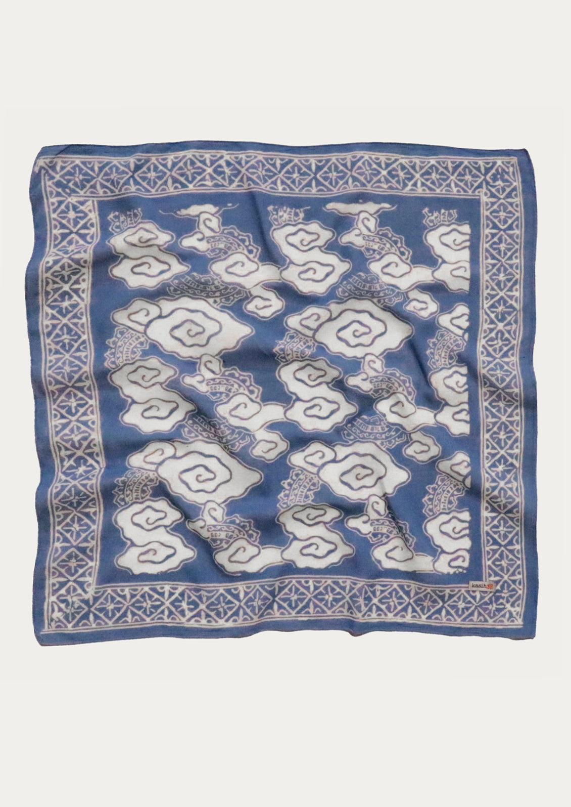 A square cotton scarf in blue and white cloud pattern.