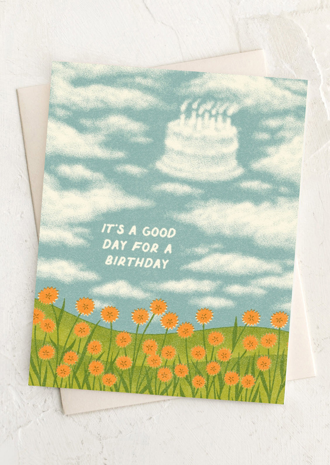 Birthday card with cake in the sky and flowers on a white background