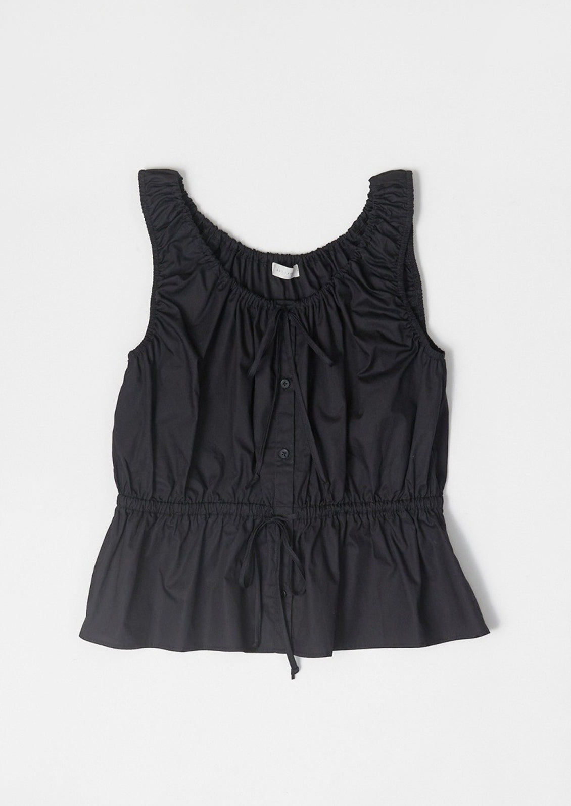 A black cinched poplin top.