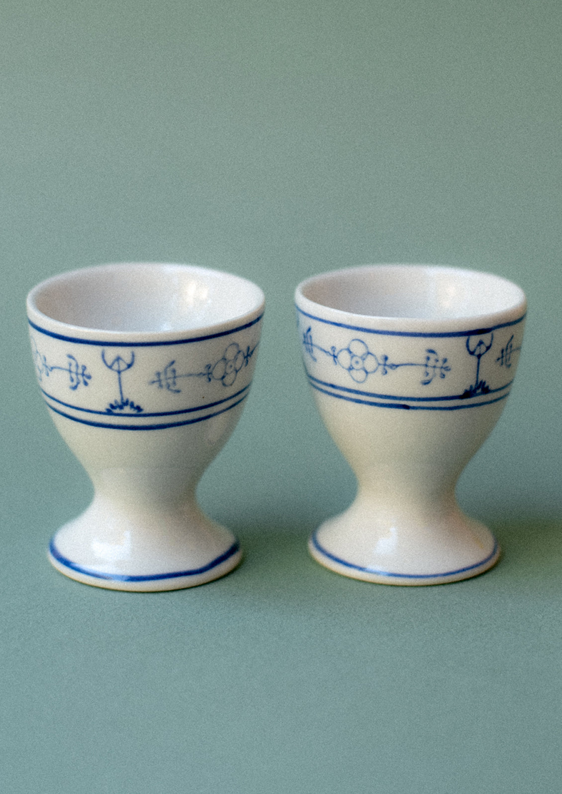 A pair of blue and white egg cups.