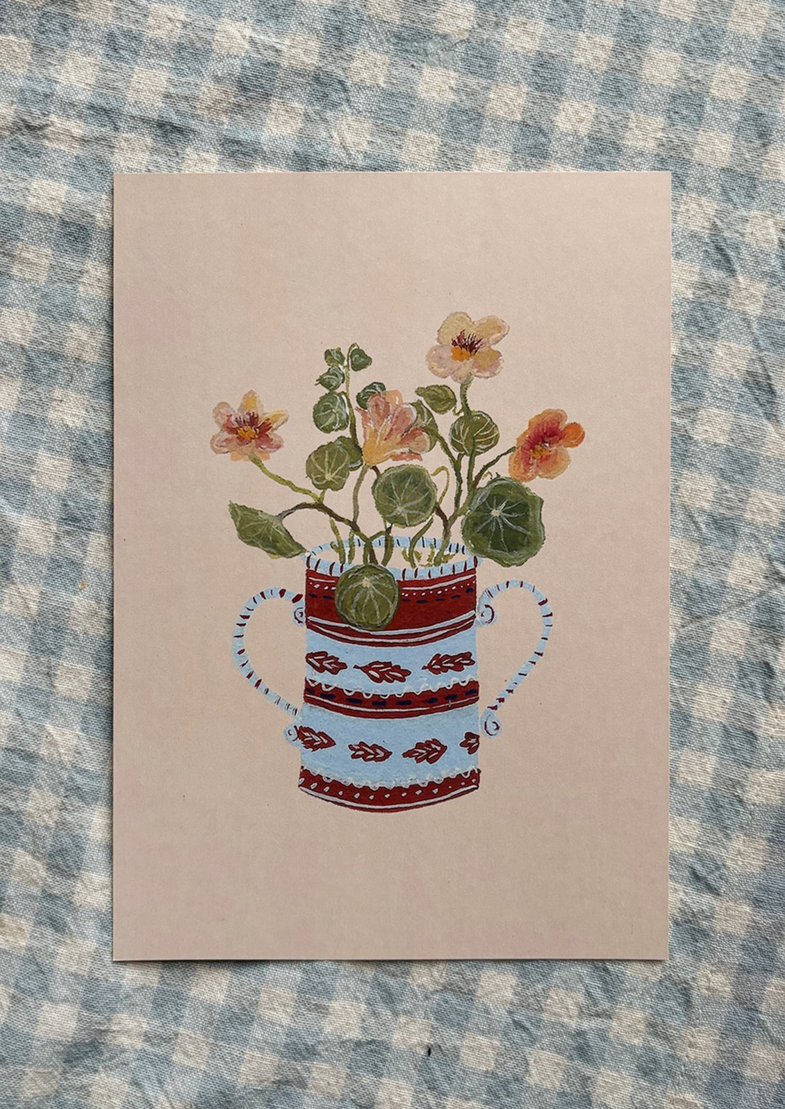 A small illustrated art print of apricot nasturtiums in blue and red pot, on light peach background.