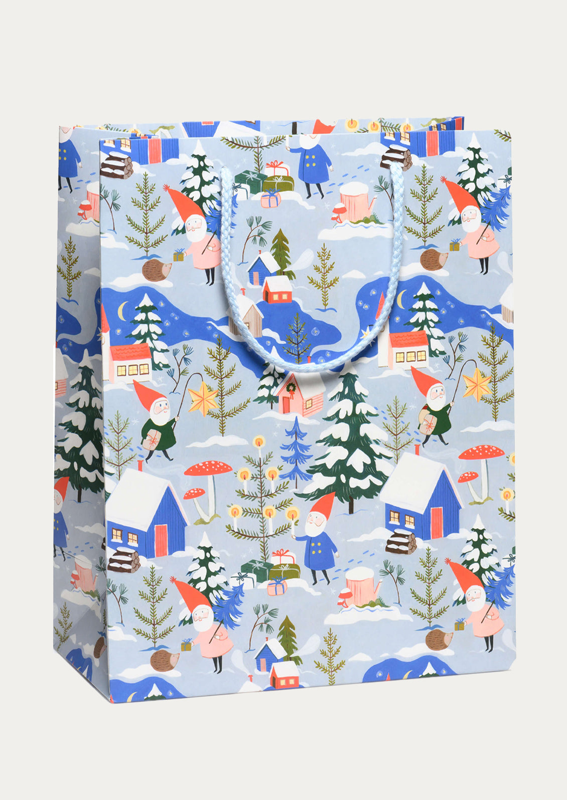 A large printed gift bag in blue with holiday gnomes print.