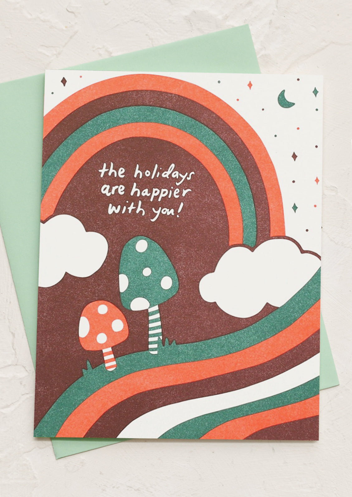 A greeting card reading "The Holidays Are Happier With You!".