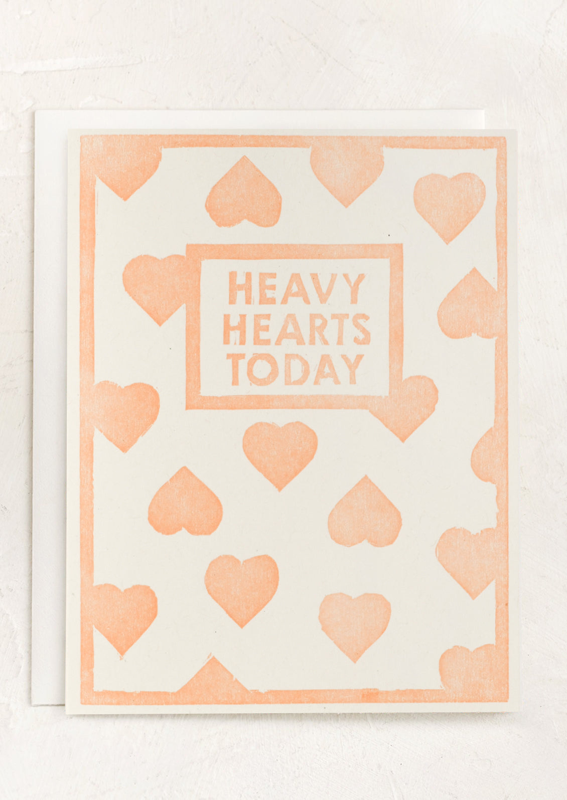 A heart print card, text reads "Heavy hearts today".