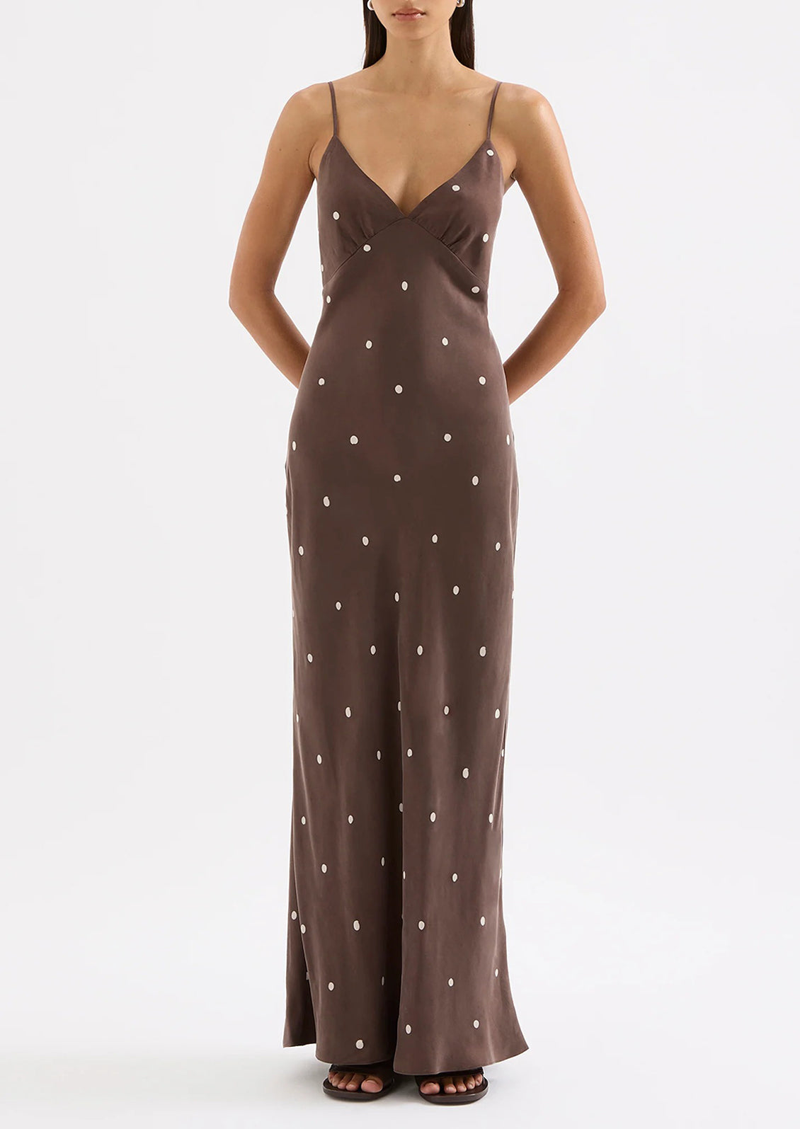 Brown evening gown with white polka dots on a white background
