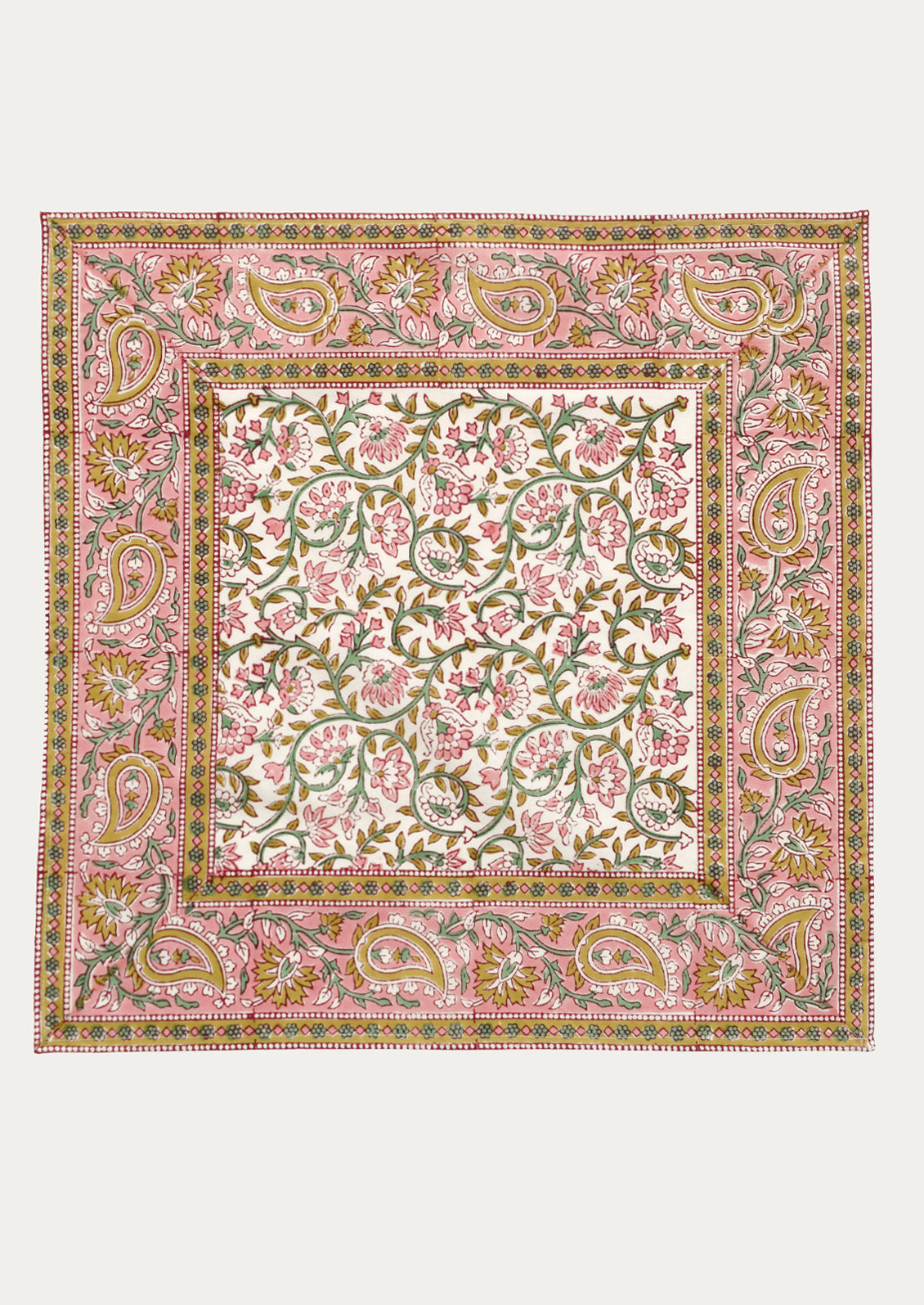 A set of cloth napkins in pink and mustard paisley print.