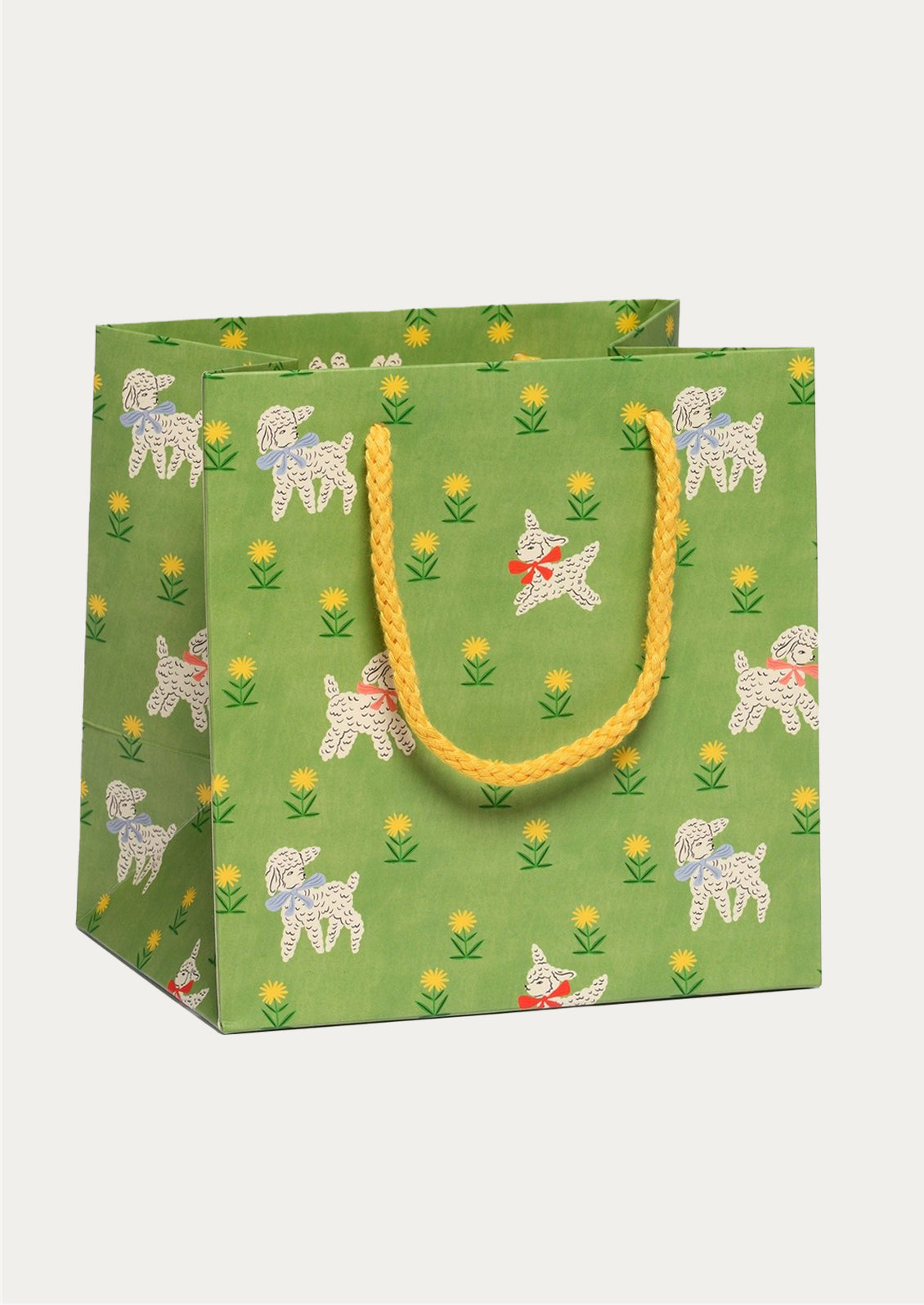Green gift bag with lamb pattern on a white background