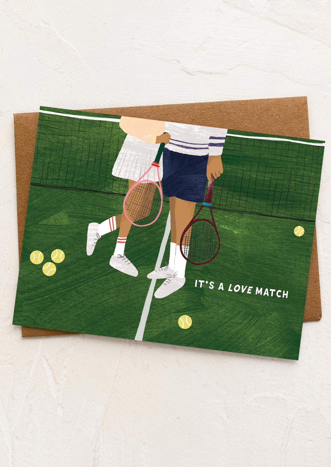 Card with illustration of two people holding hands on a tennis court with the text 'It's a Love Match'.