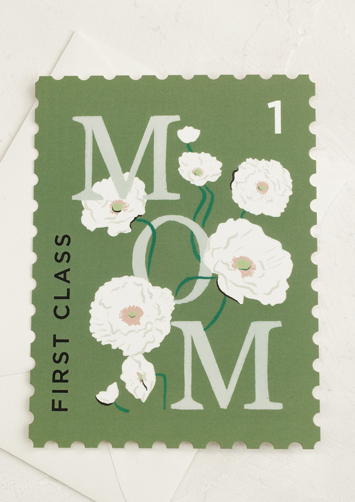 A diecut stamp shape card reading "First class mom".