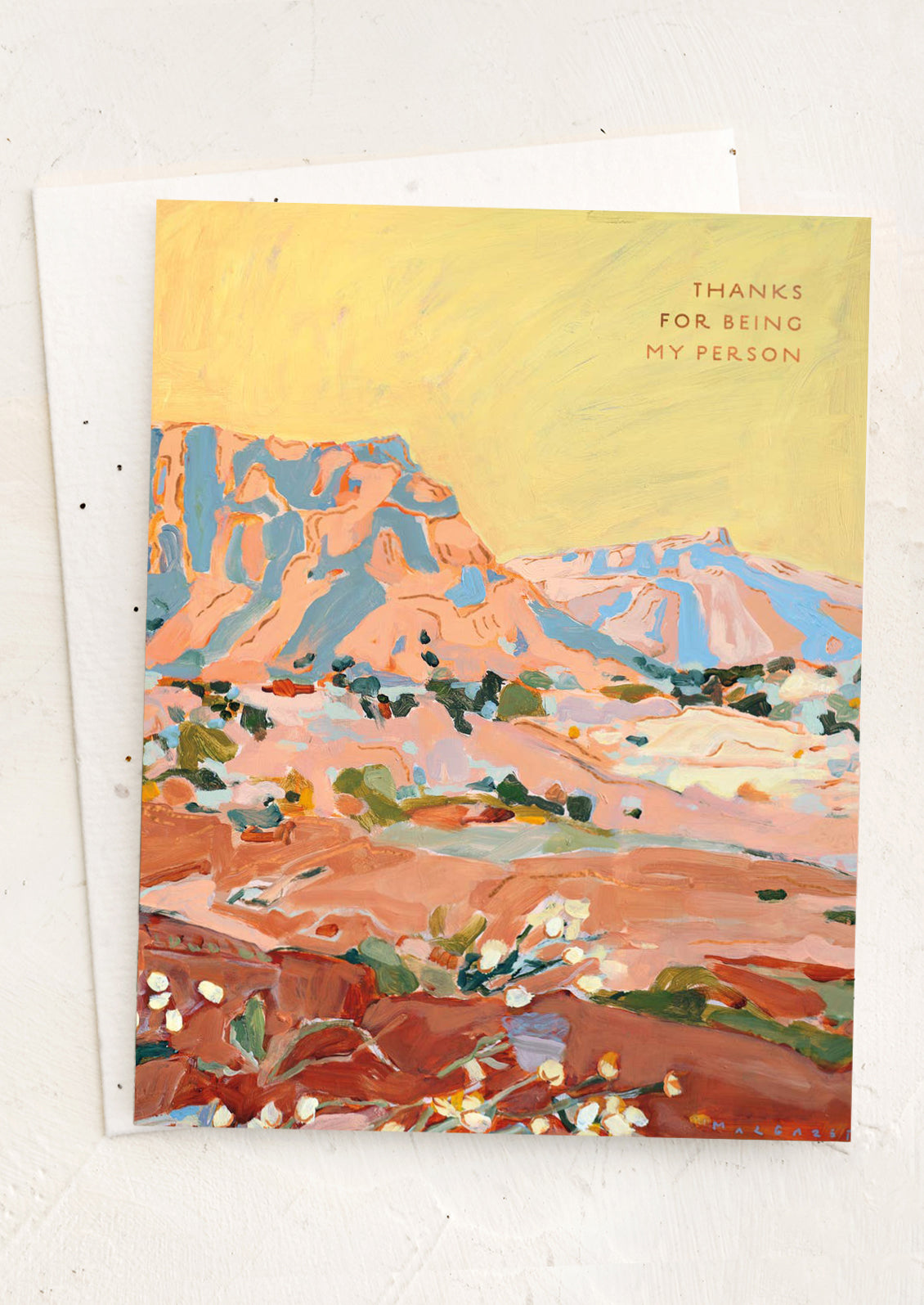 Greeting card with a colorful landscape illustration and 'Thanks for being my person' text on a white background.