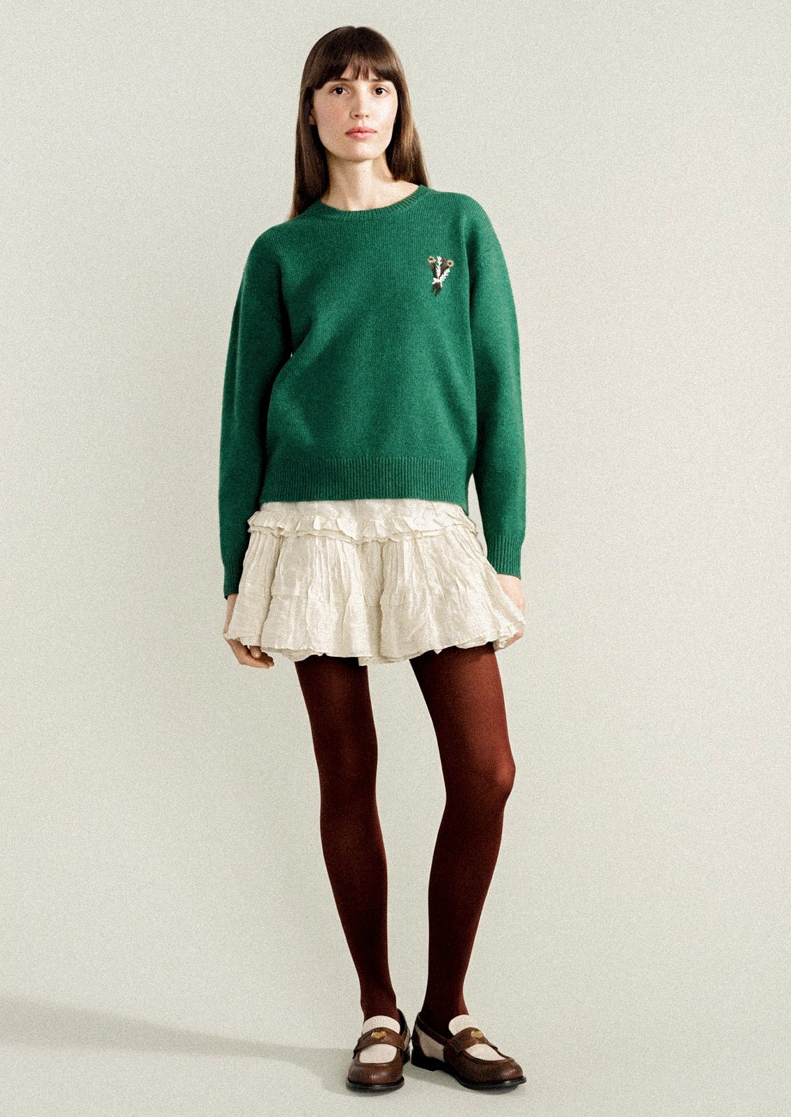A woman wearing opaque brown tights.