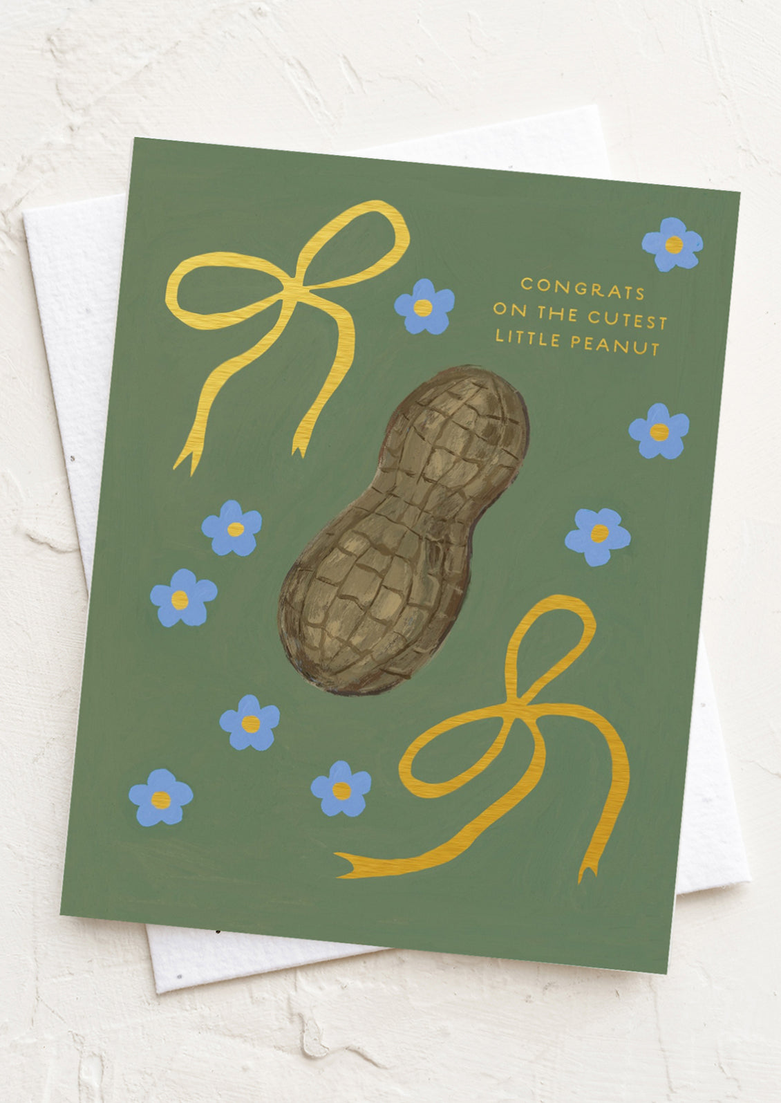 Greeting card with a peanut illustration and decorative elements on a green background