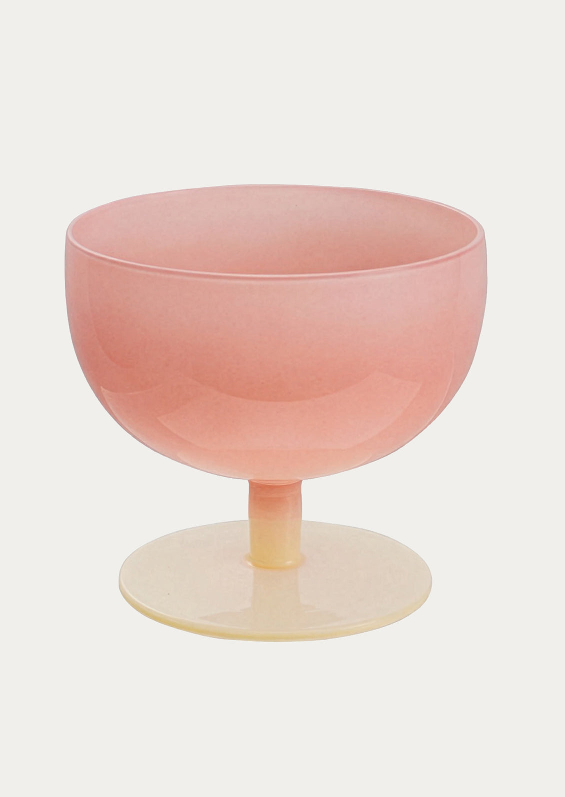 Pink glass with a thin stem on a white background