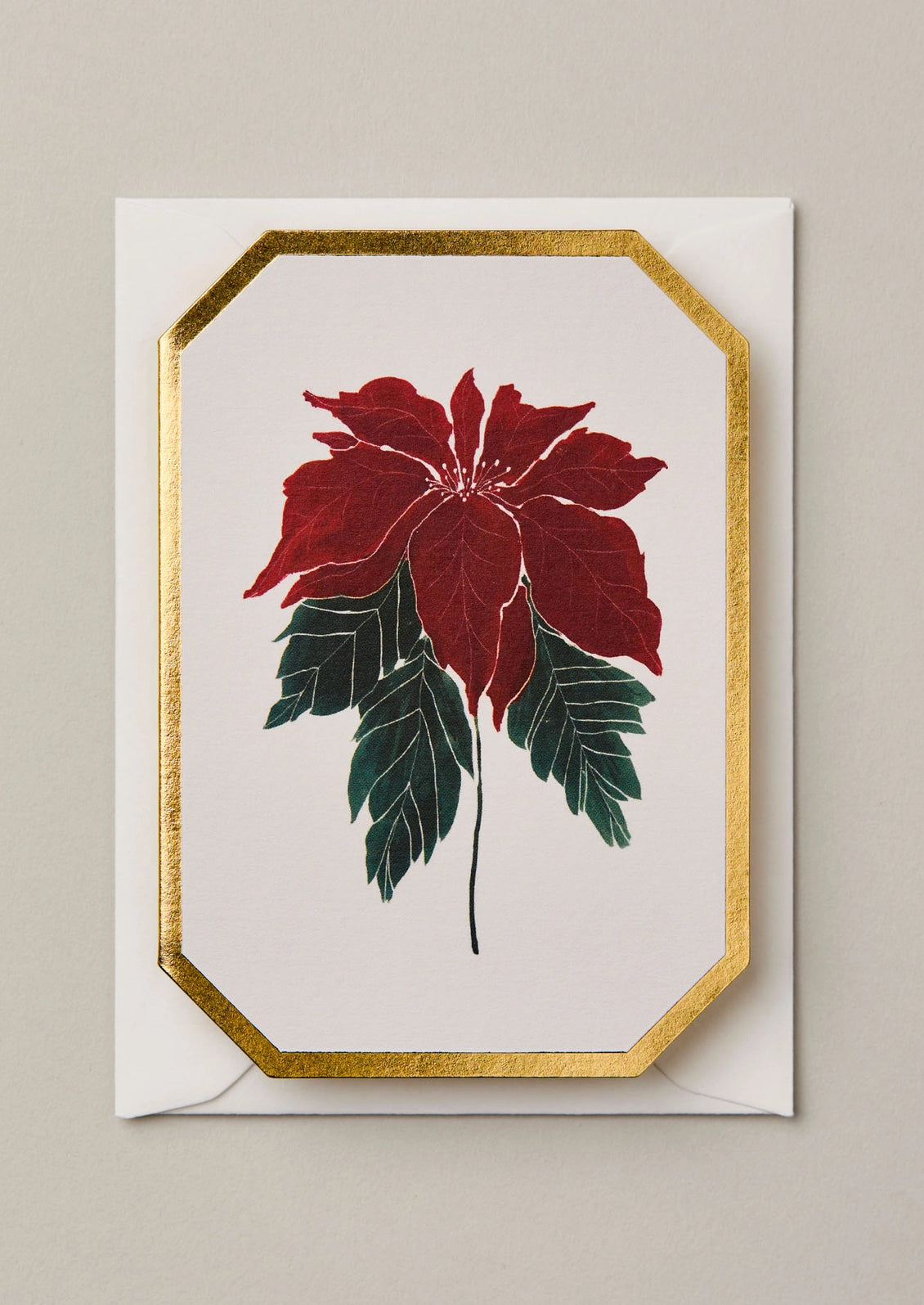 A mini die cut greeting card with poinsettia illustration.