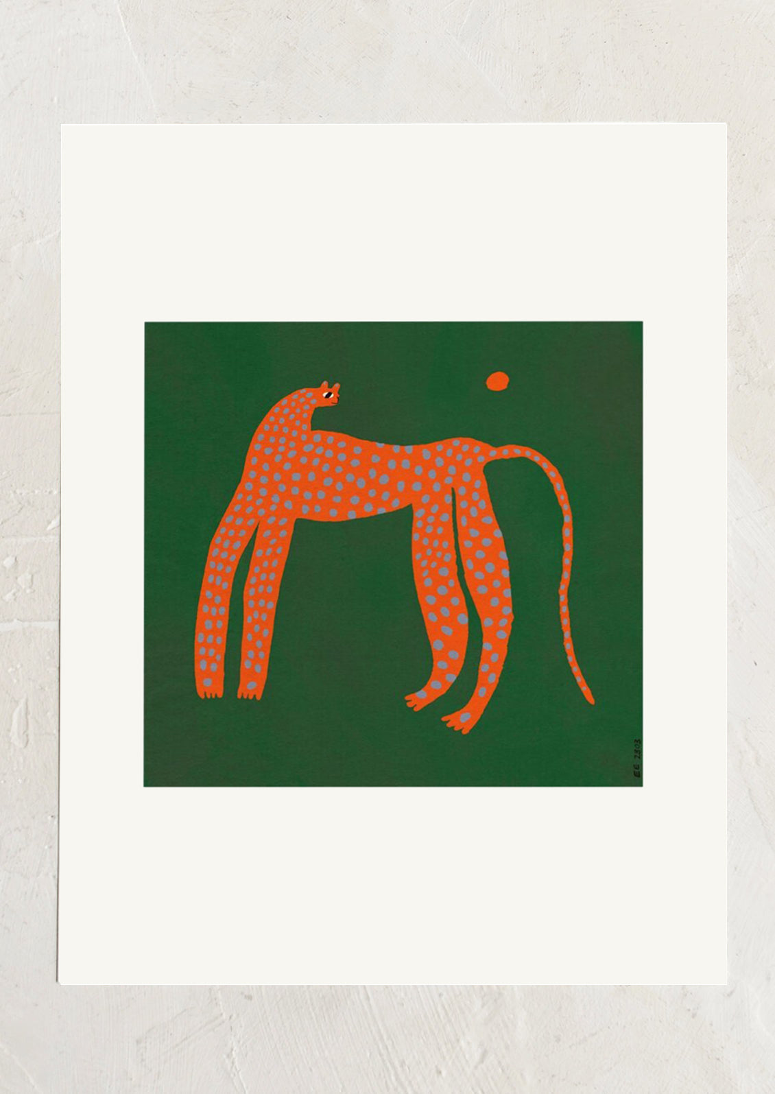 An art print with wide white border, green square at middle with abstract red panther with blue spots.