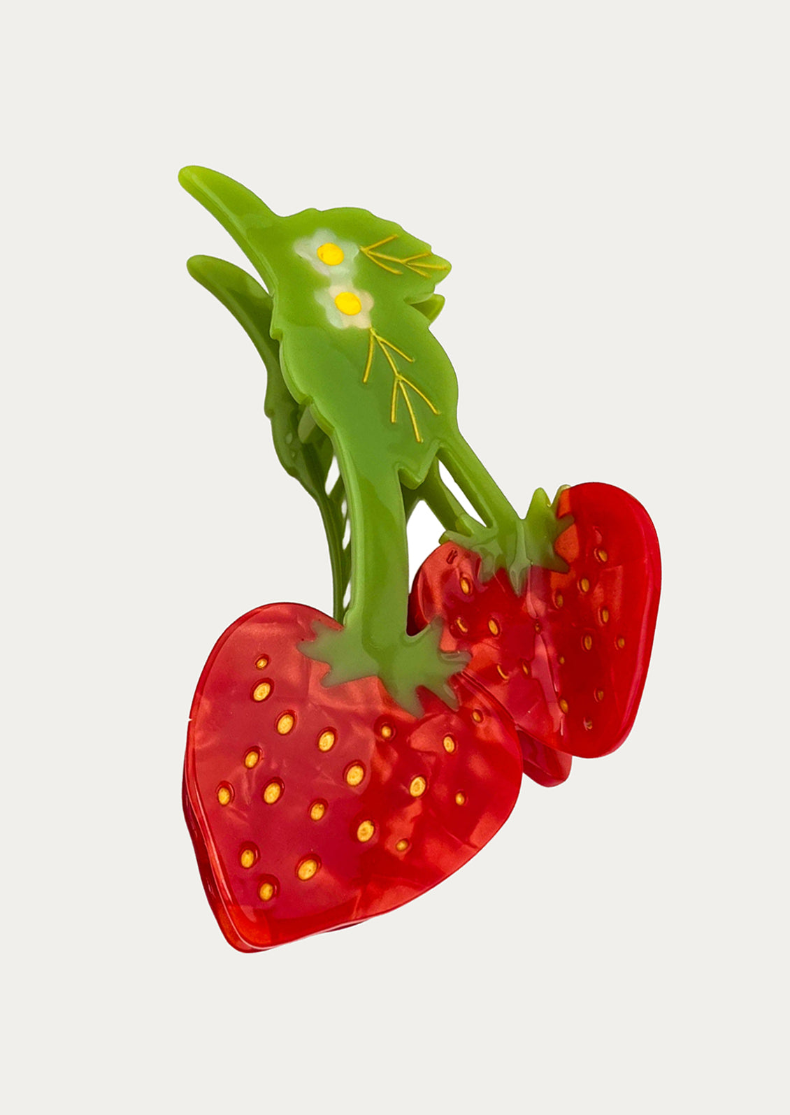 Transparent strawberry with red and green colors on a white background