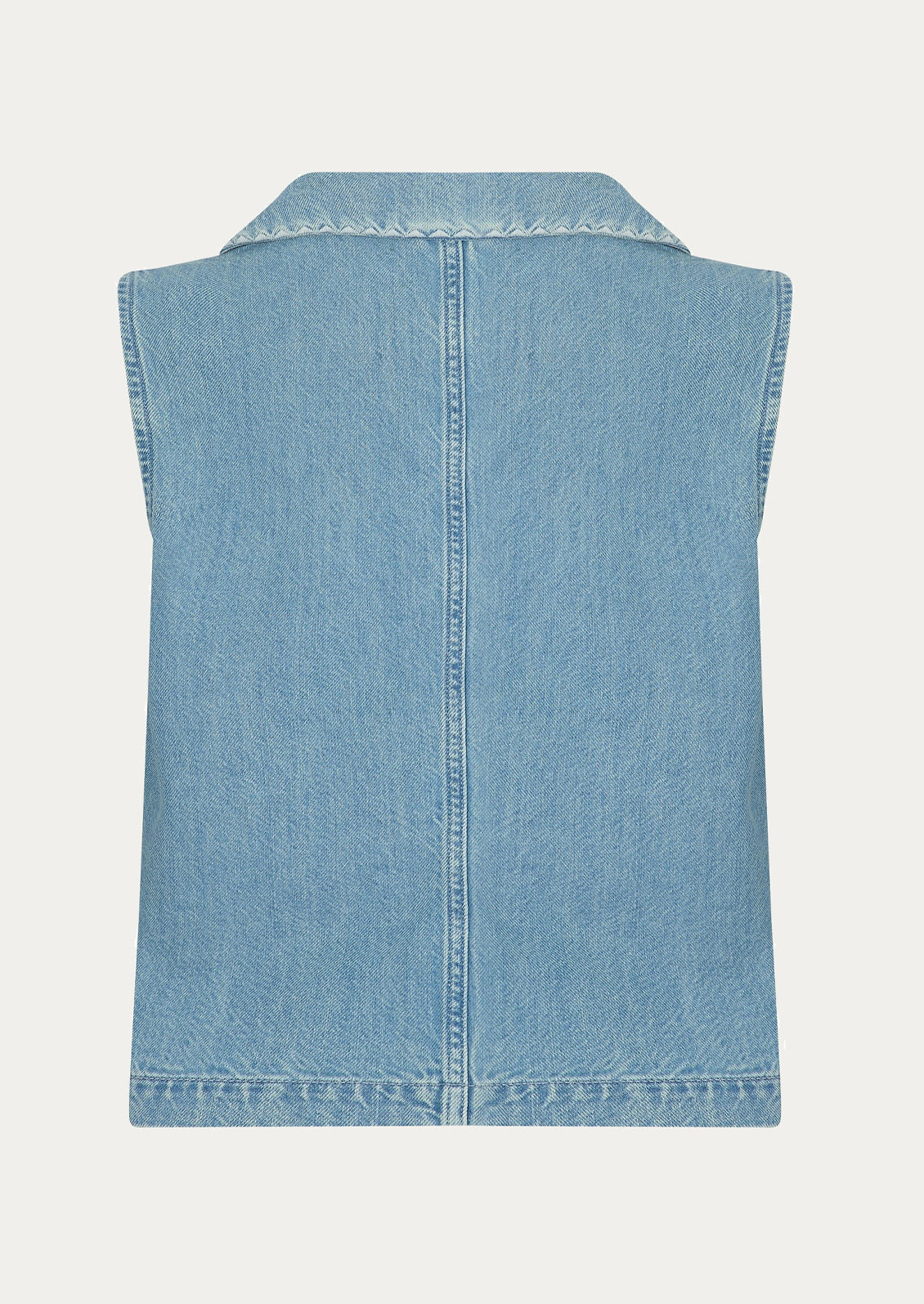 A sleeveless button front top with pointed collar, in light wash denim.