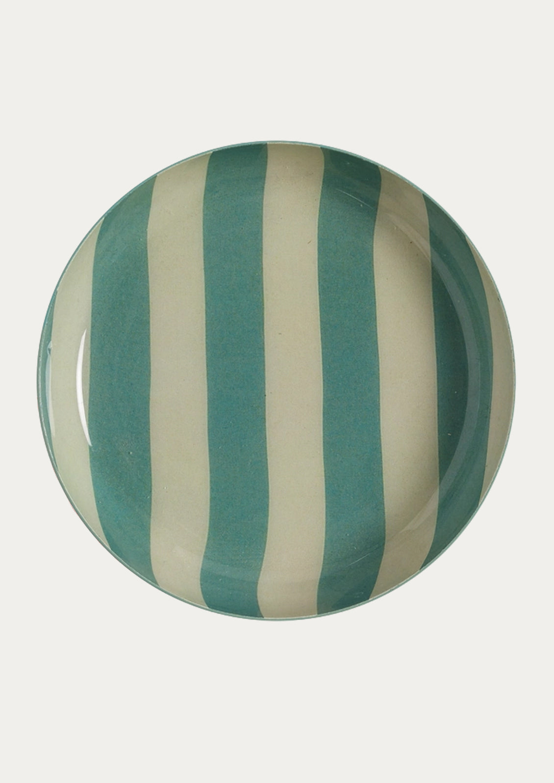 A round enamel plate featuring wide stripes in aqua and warm cream.