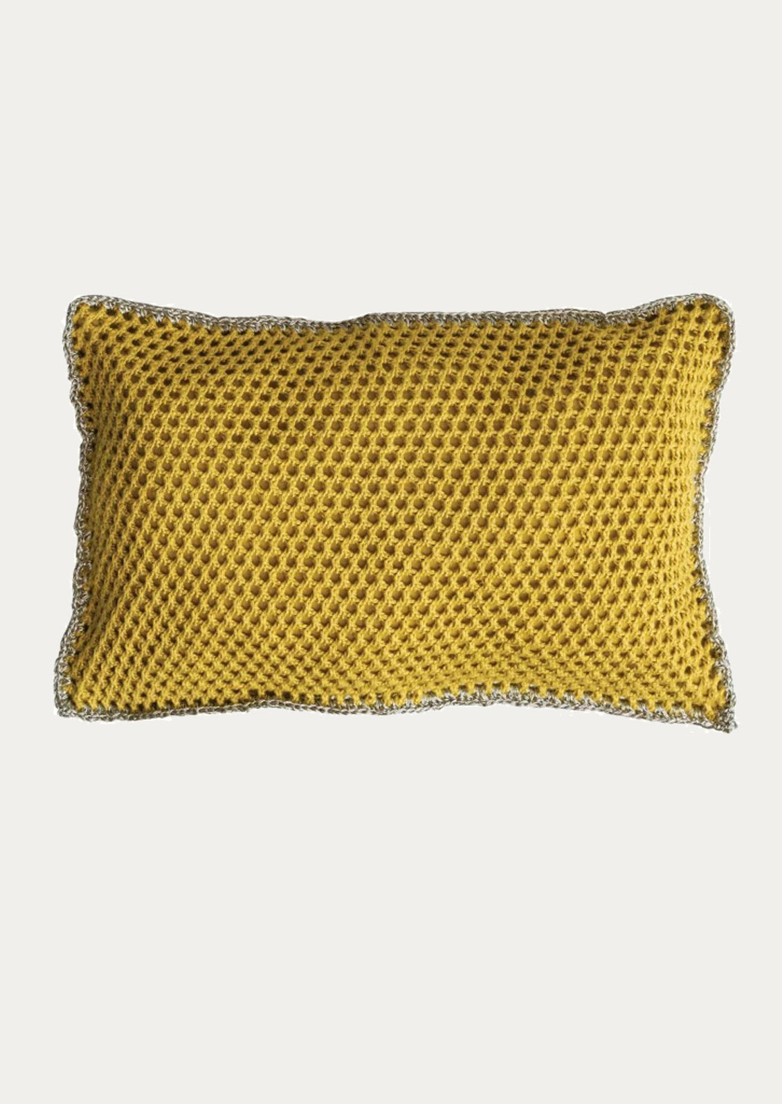 Yellow textured pillow on a white background