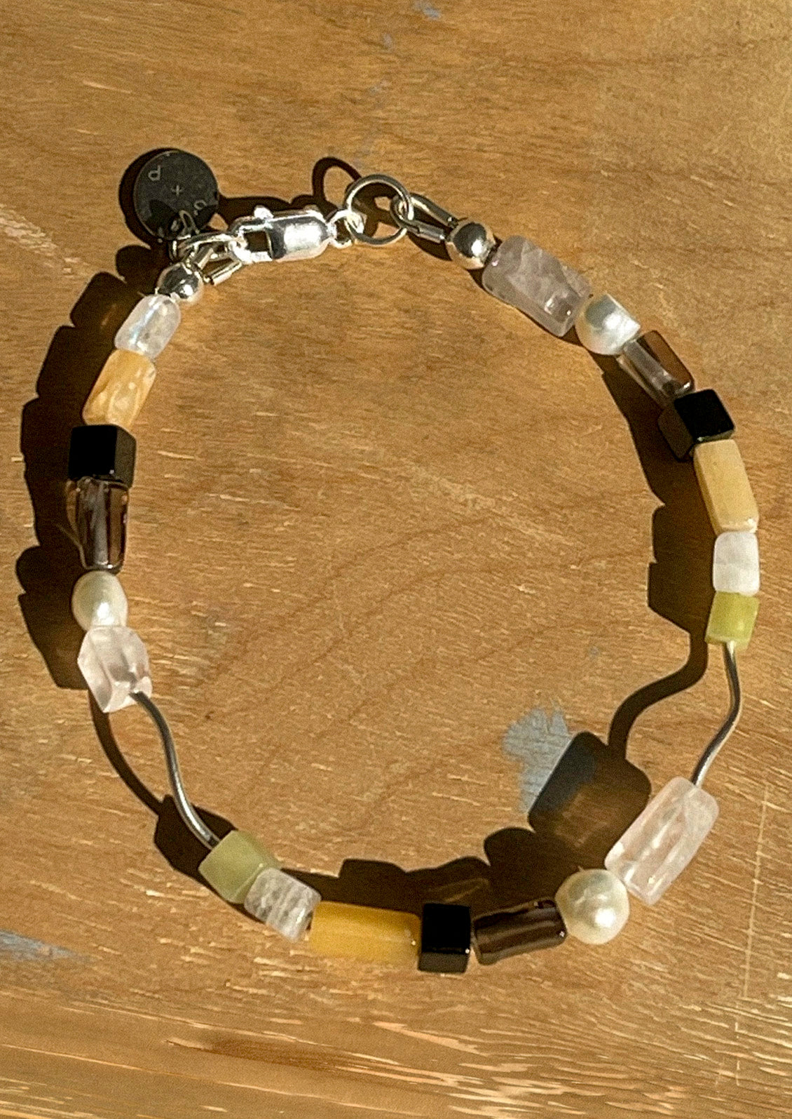 A sterling silver bracelet with a variety of agate beads.
