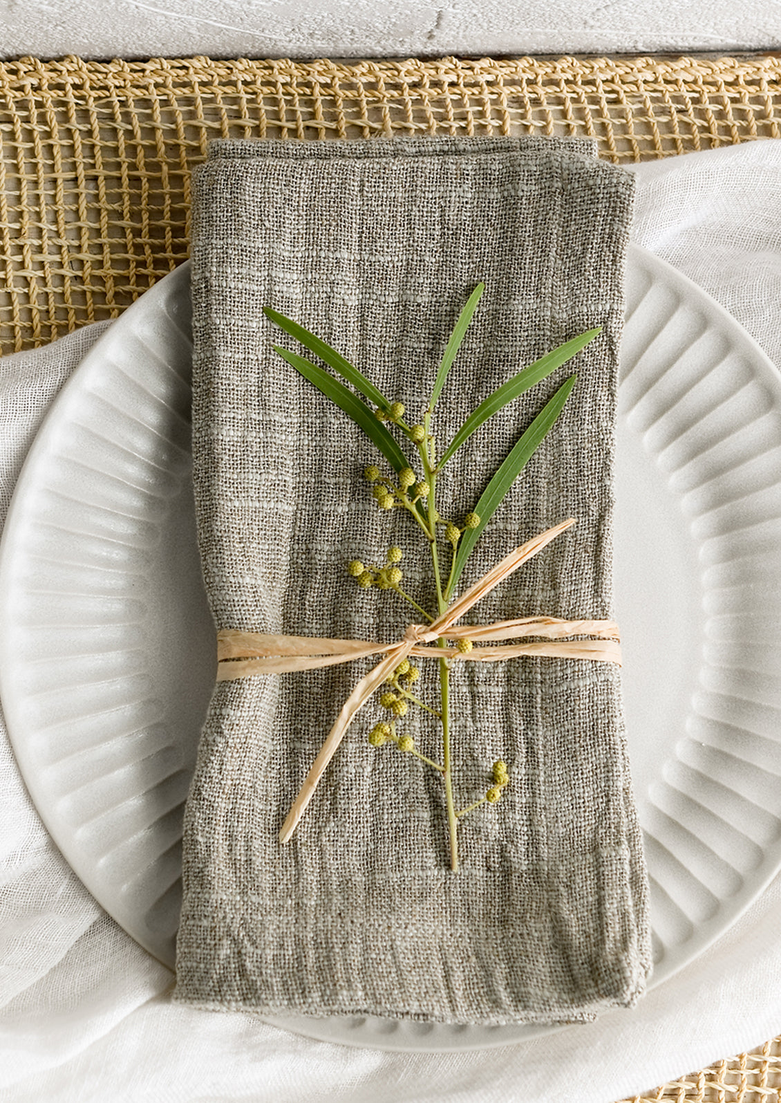 A napkin on a fluted plate.