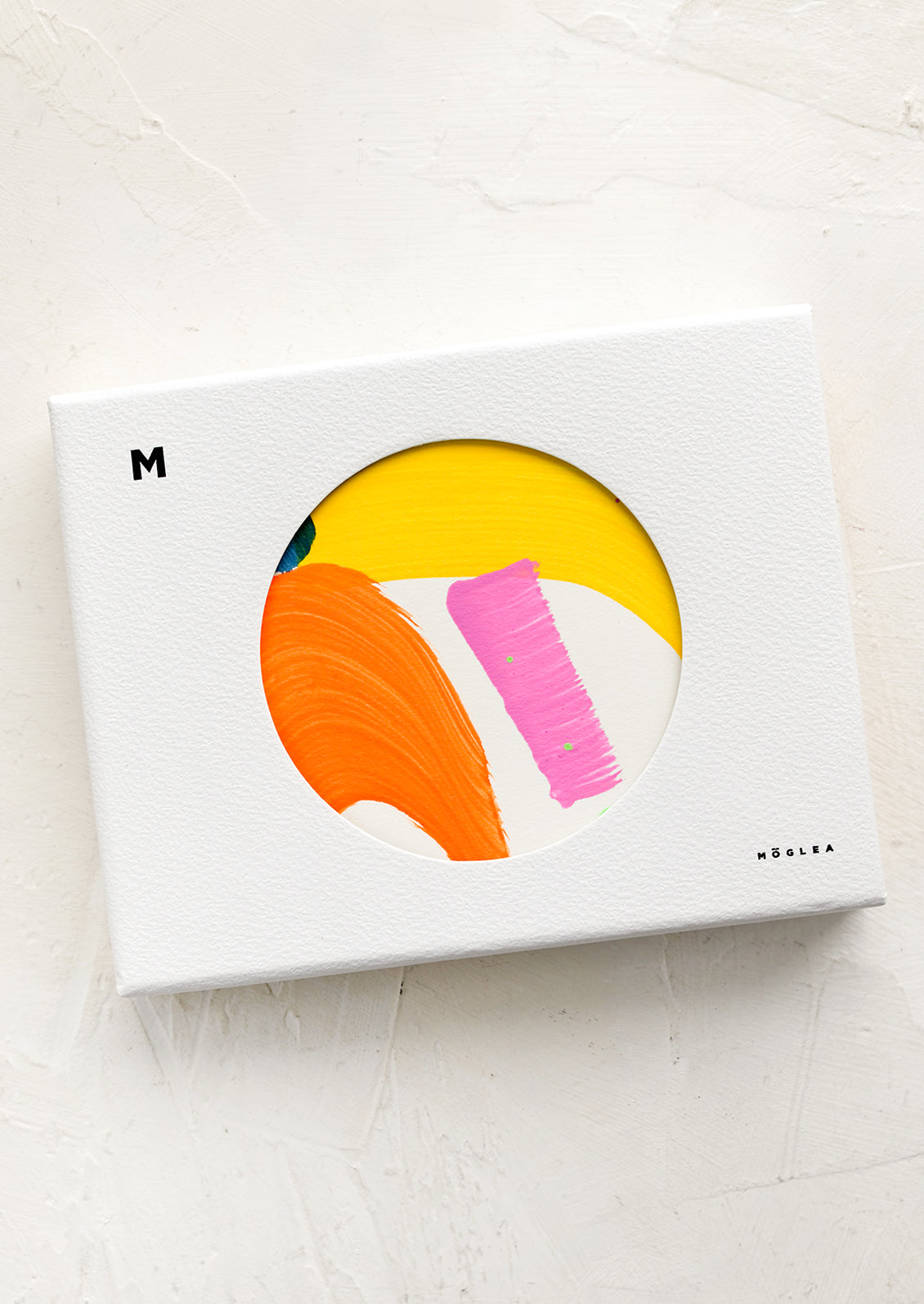 A set of saturated color abstract painted greeting cards in a box.