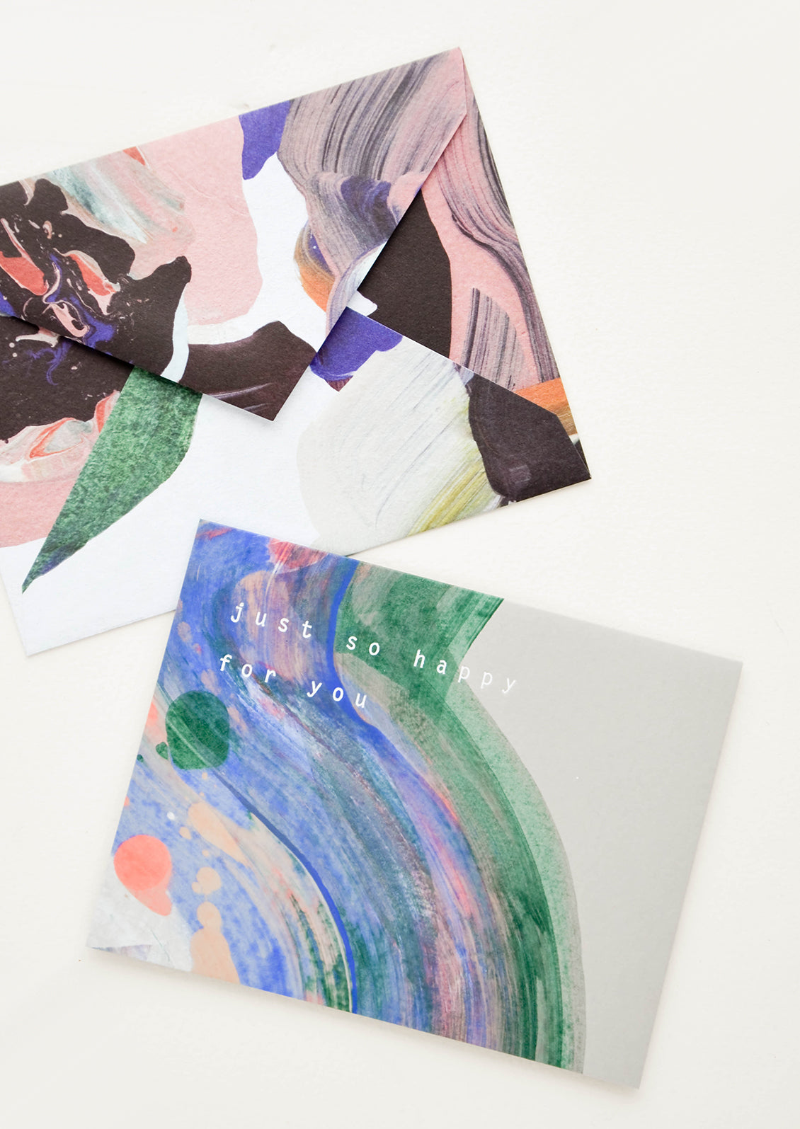 Greeting card reading "just so happy with you" paired with artful abstract printed envelope