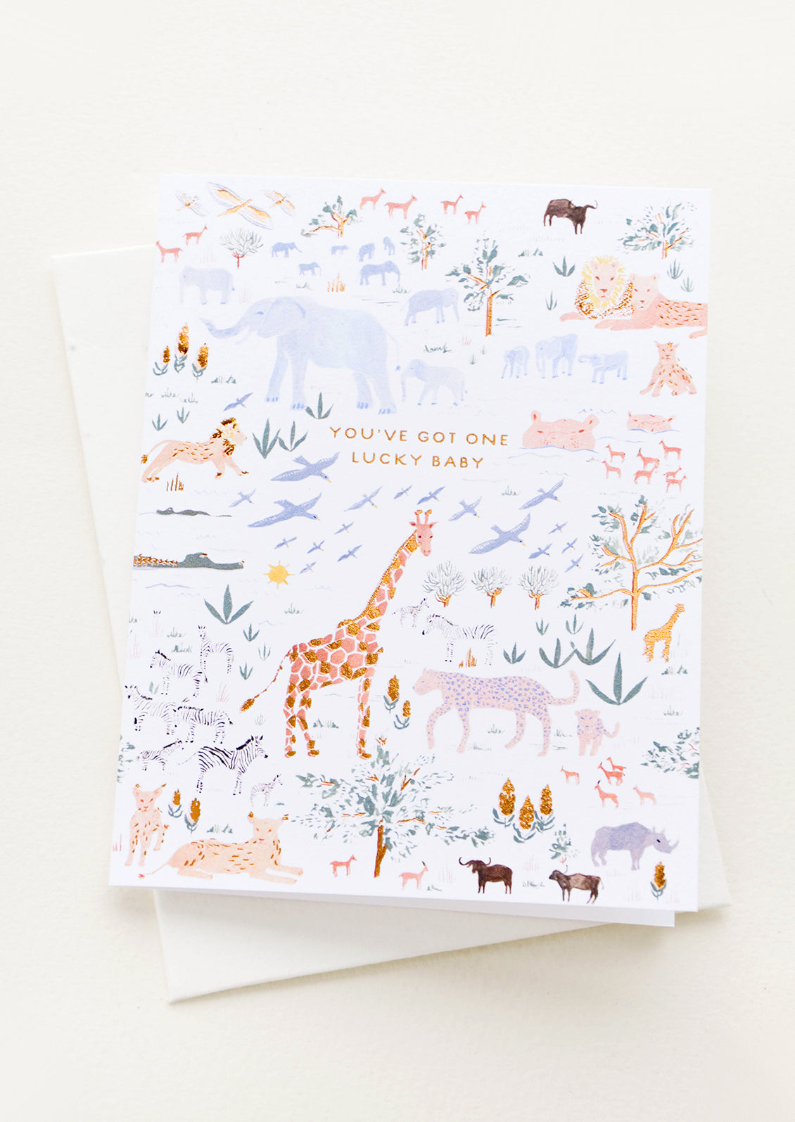 Greeting card with African animal print, small golden lettering reading "You've Got One Lucky Baby"