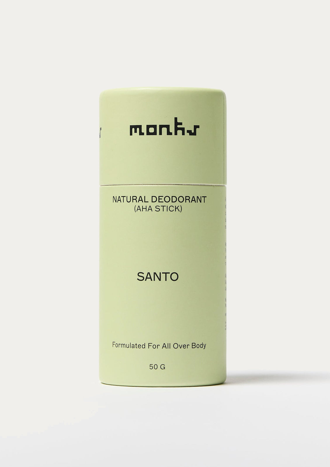 Green deodorant stick with 'monks' branding on a white background