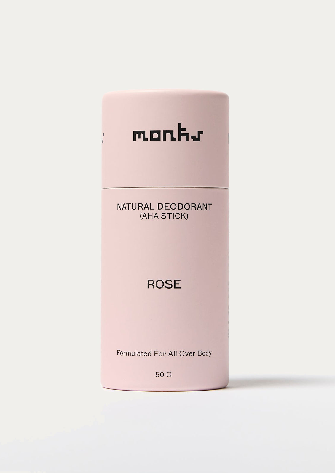 Pink deodorant stick with 'monks' branding on a white background
