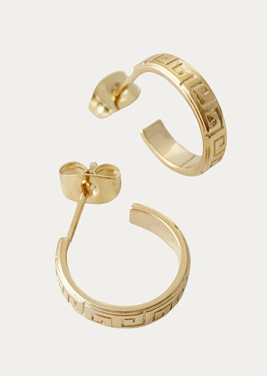 Gold-tone hoop earrings with a Greek key pattern, shown on a light gray background.
