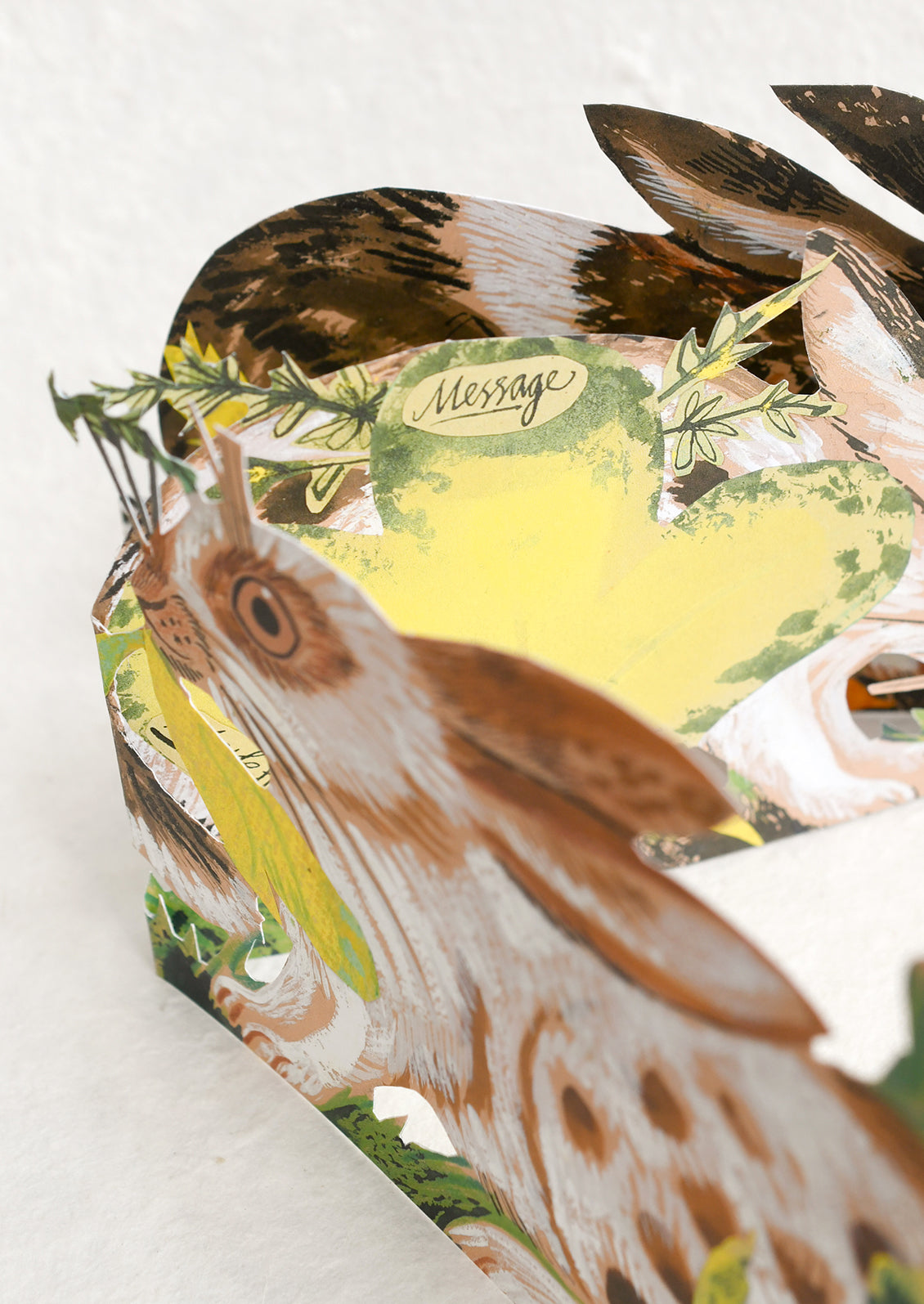 Card with a bird illustration and 'Message' text on a white background