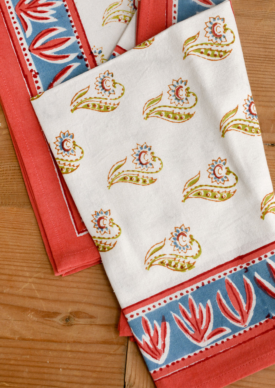 Set of colorful patterned napkins on a wooden surface