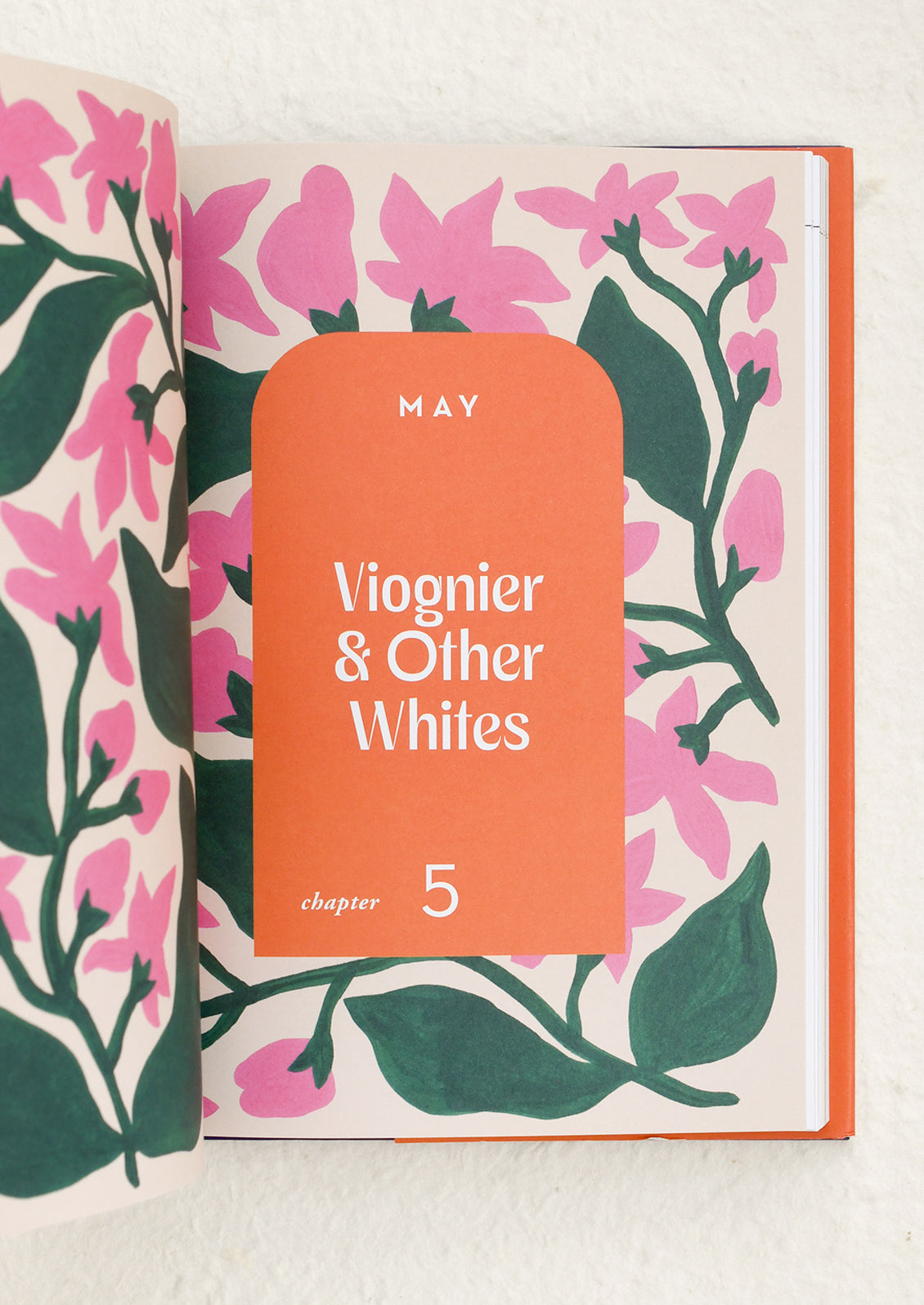 Open book page with floral illustrations.