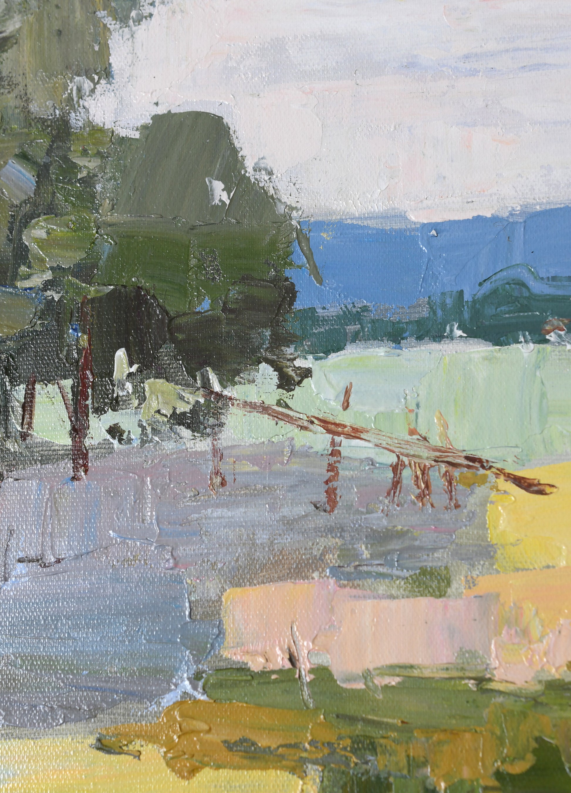Impressionistic landscape painting with thick brushstrokes in green, blue, gray, yellow, and soft pink tones, depicting trees, open land, and distant hills.