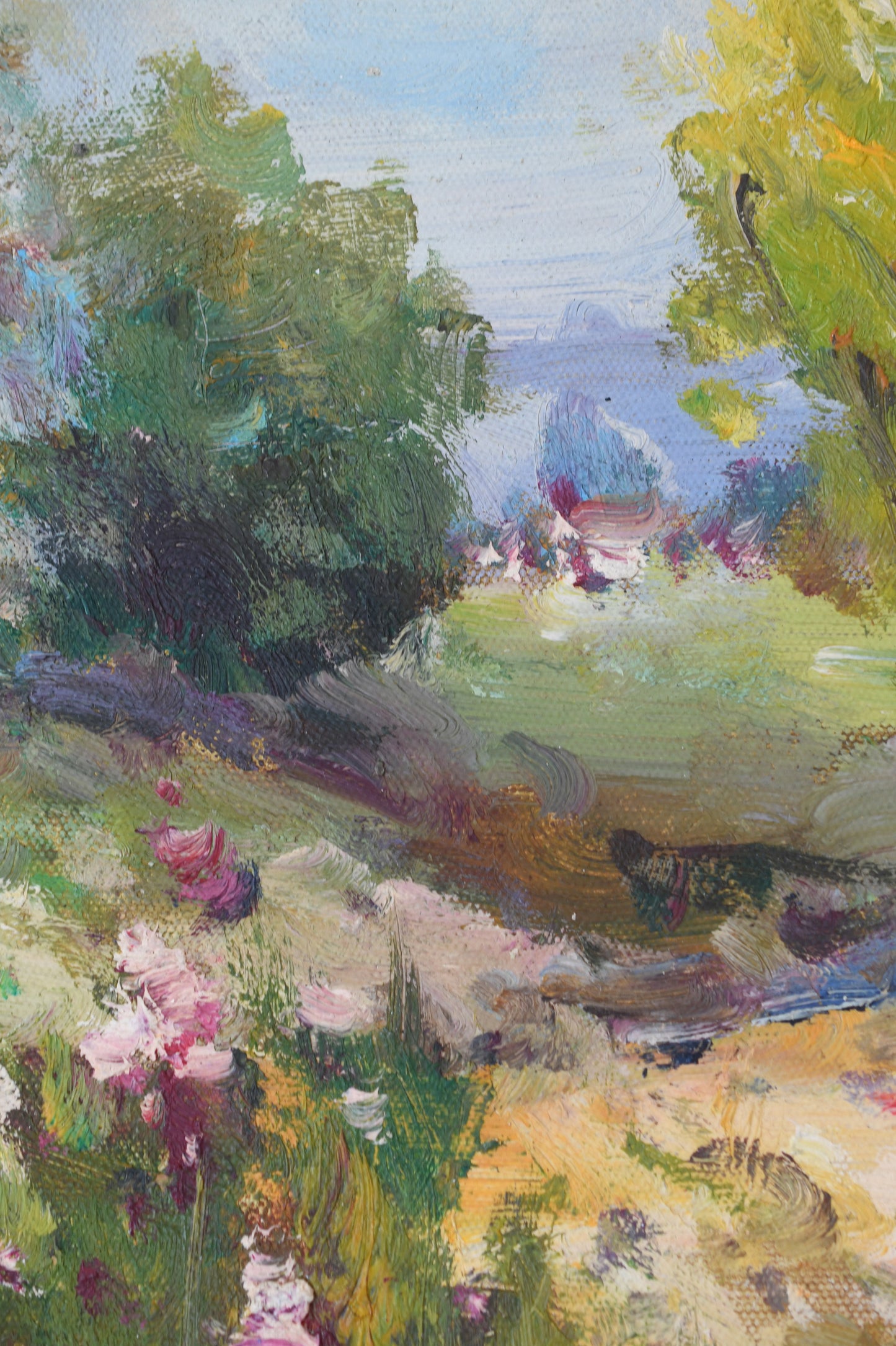 Impressionistic landscape painting on canvas featuring lush green trees, a grassy field, distant blue mountains, and pink flowers in the foreground, rendered with textured brushstrokes.