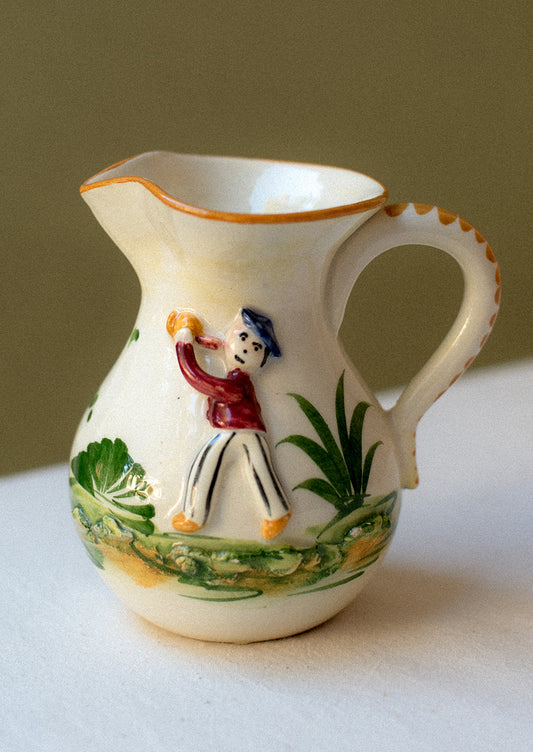 Vintage hand-painted porcelain mini pitcher / creamer with three-dimensional relief detail.