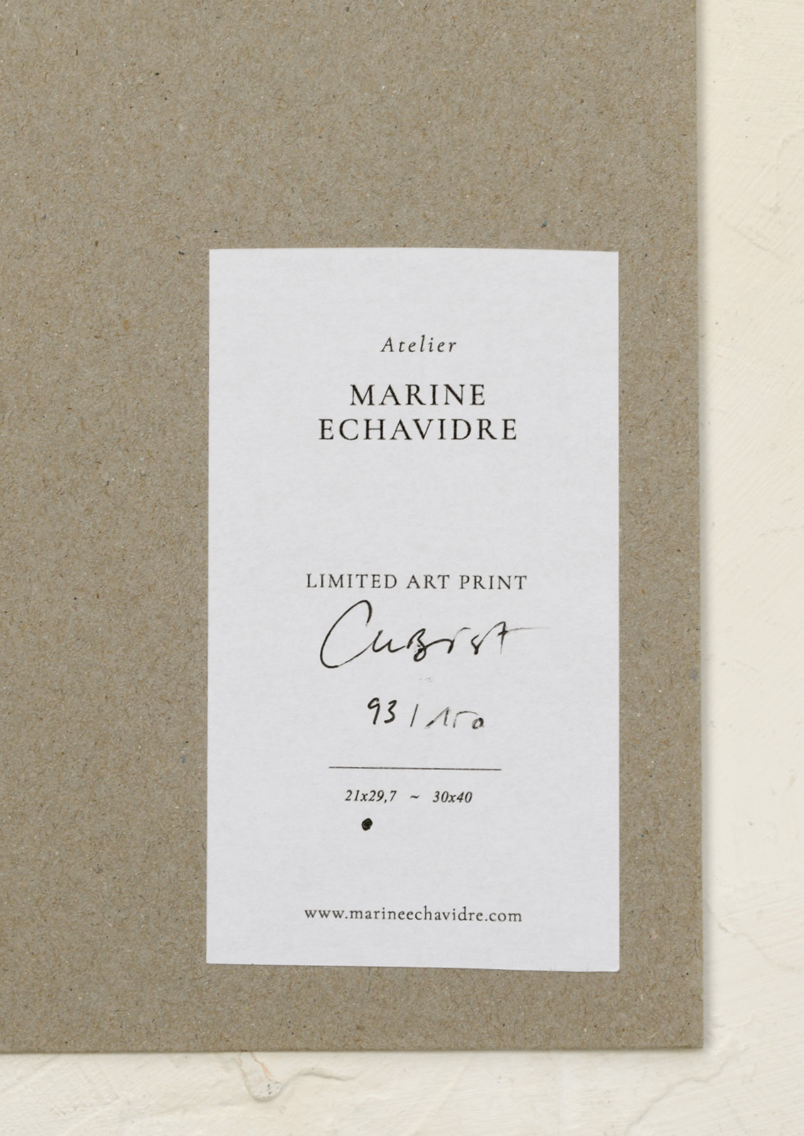 An abstract art print in neutral tones.