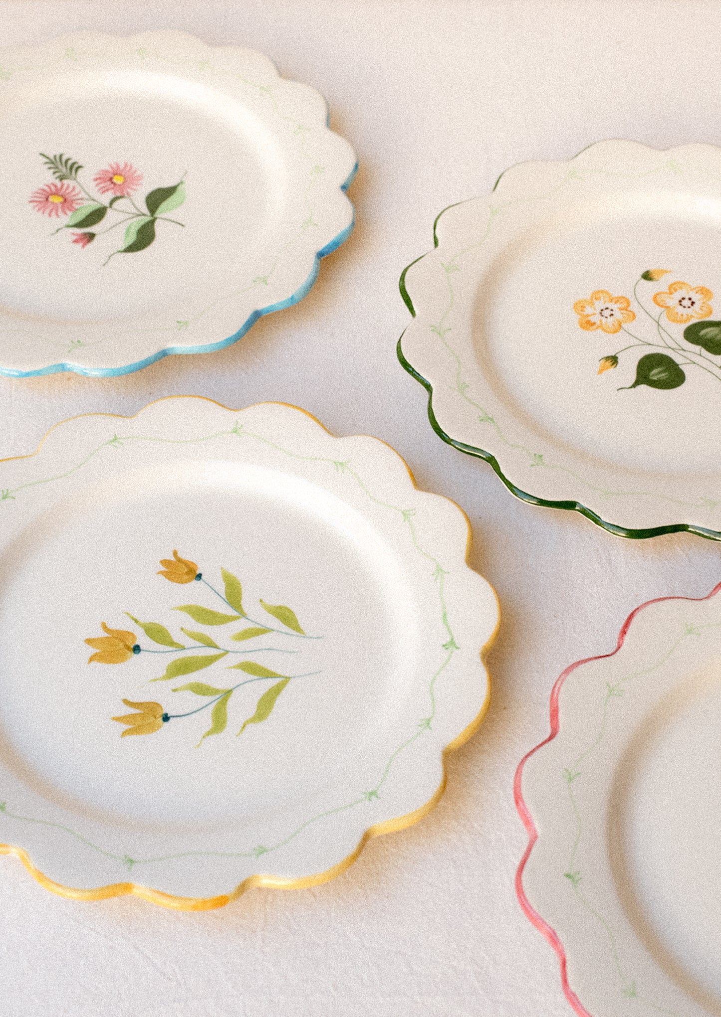 Set of decorative plates with floral patterns on a light background