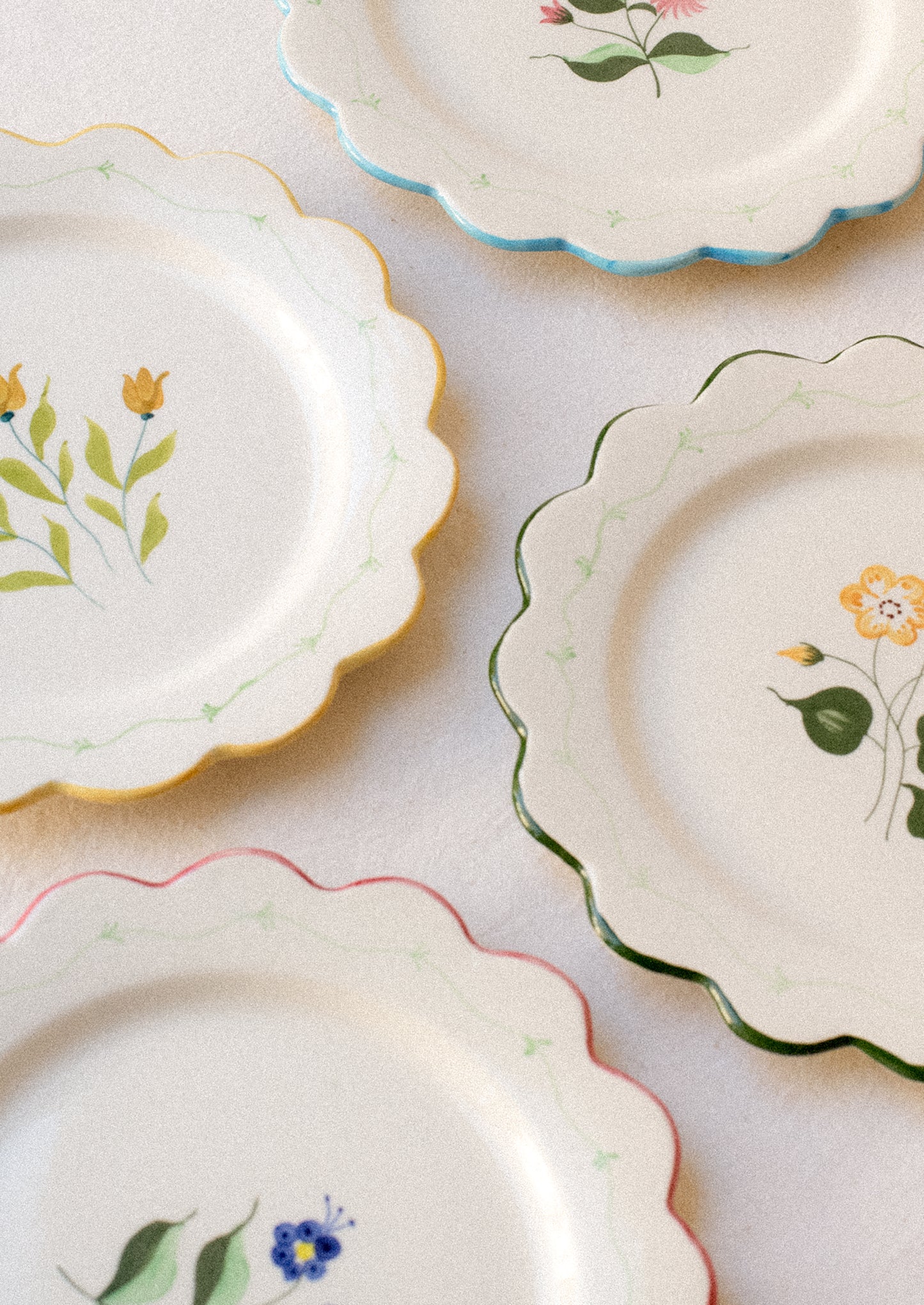 Set of decorative plates with floral patterns on a light background