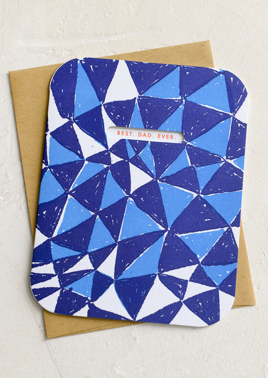 A blue triangle print card with cutout window revealing red lettering reading "Best. Dad. Ever.".