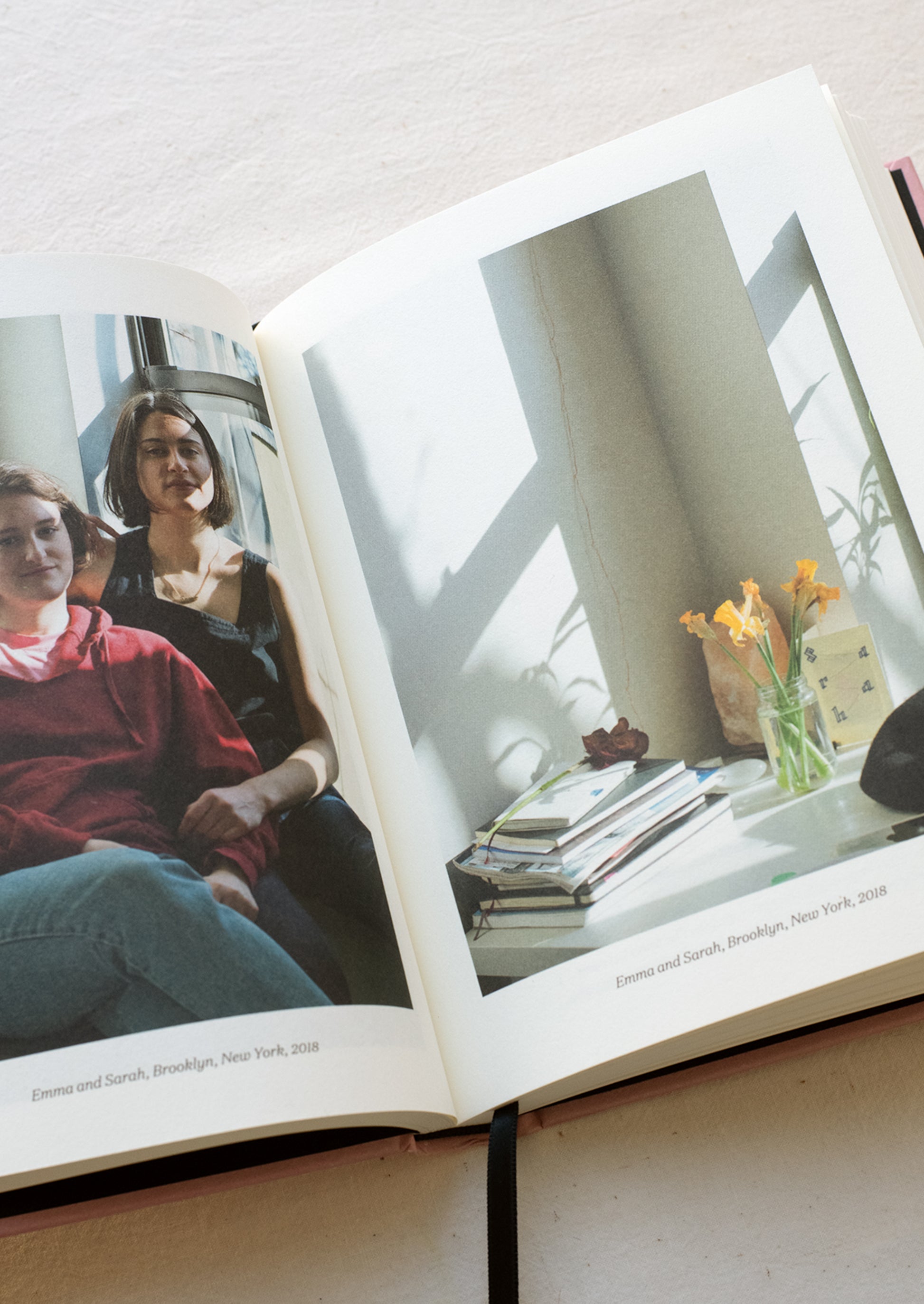 A page in a book showing photography of the apartment of two females.