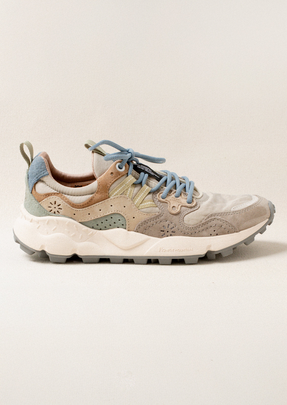 A pair of sporty sneakers in taupe/pastel multi color combo.